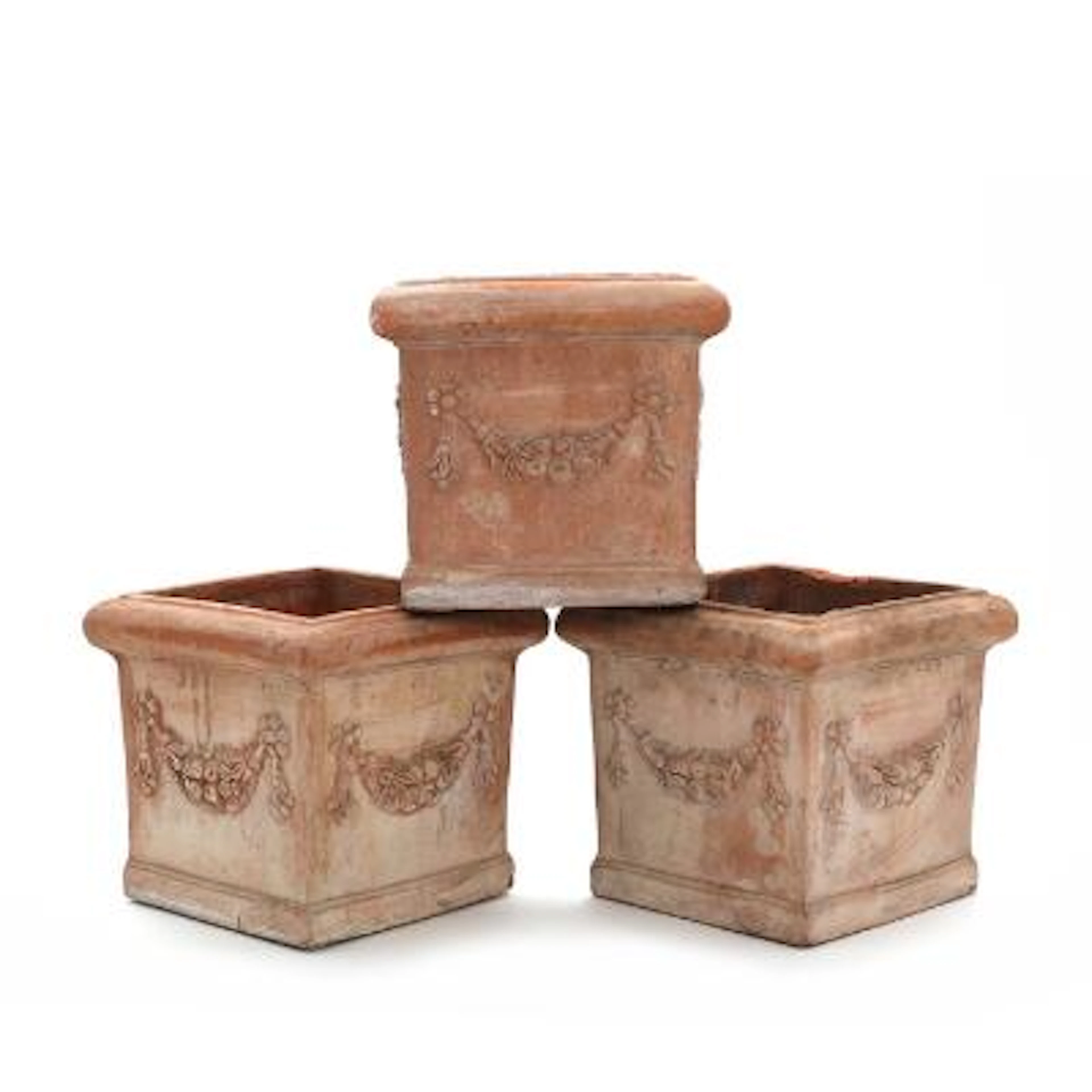 Three Italian terracotta flower urns, modelled with floral garlands