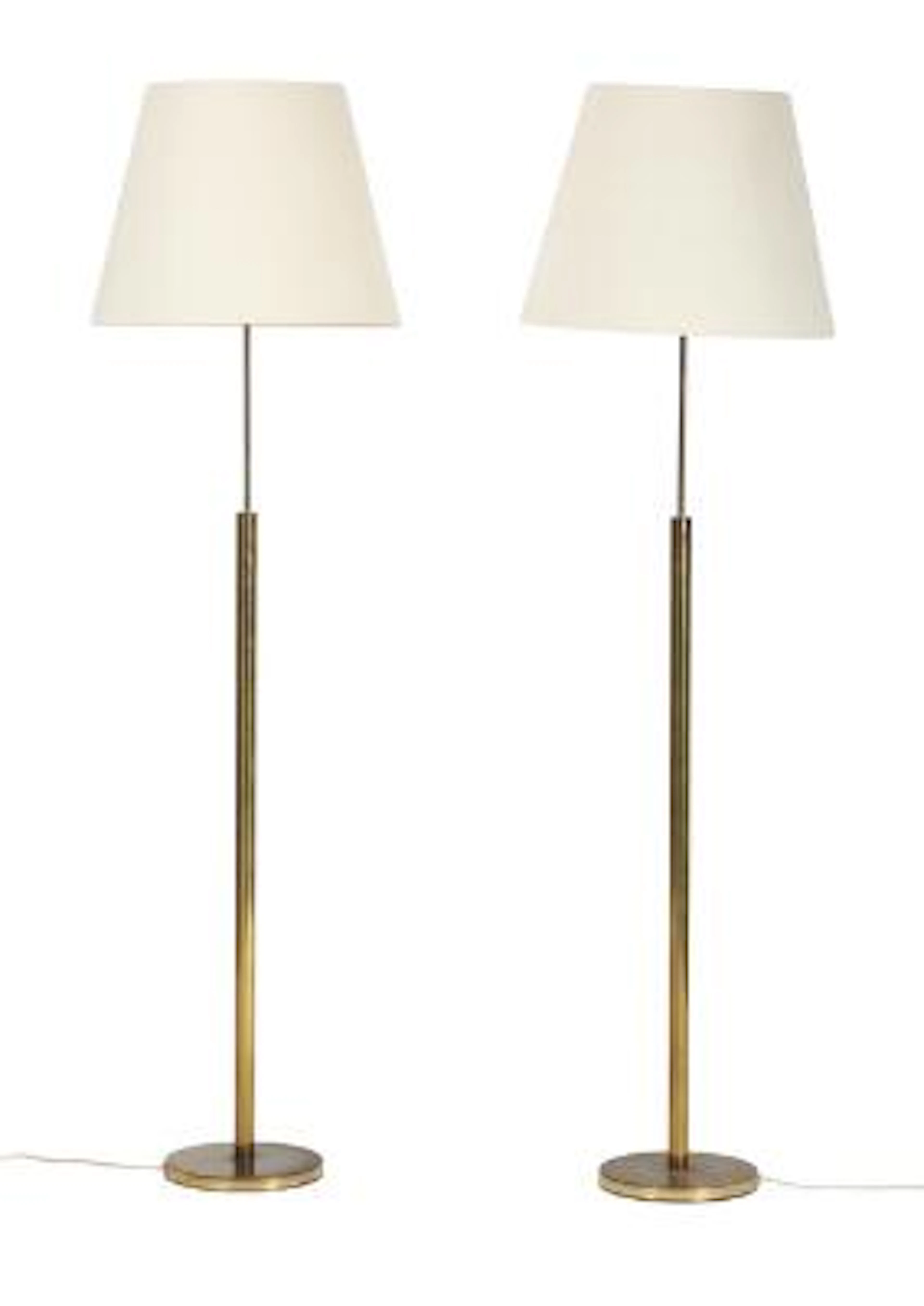 Danish design: A pair of brass floor lamps, mounted with shades with