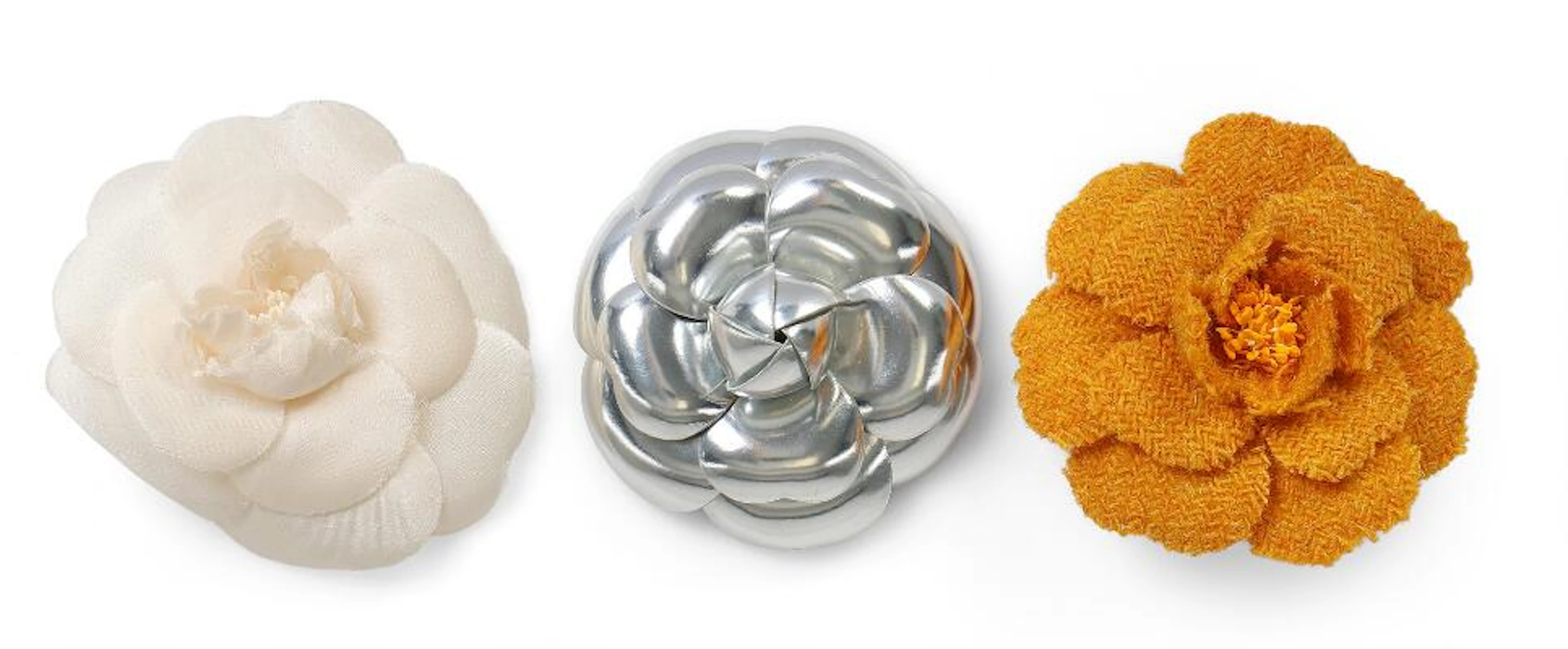 Chanel: A set comprising of three brooches in the shape of a camelia