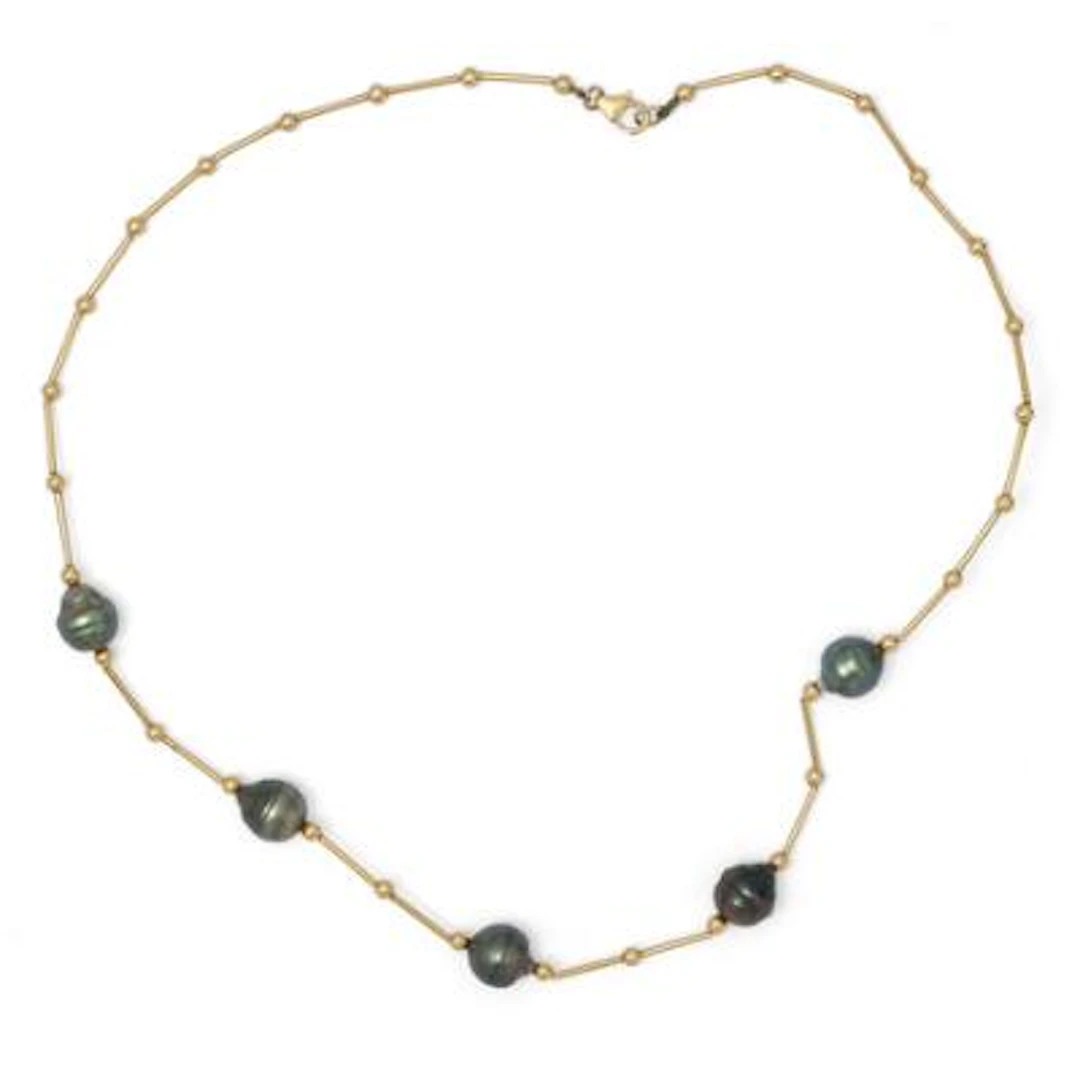 A pearl necklace set with five baroque Tahiti pearls, mounted in 18k