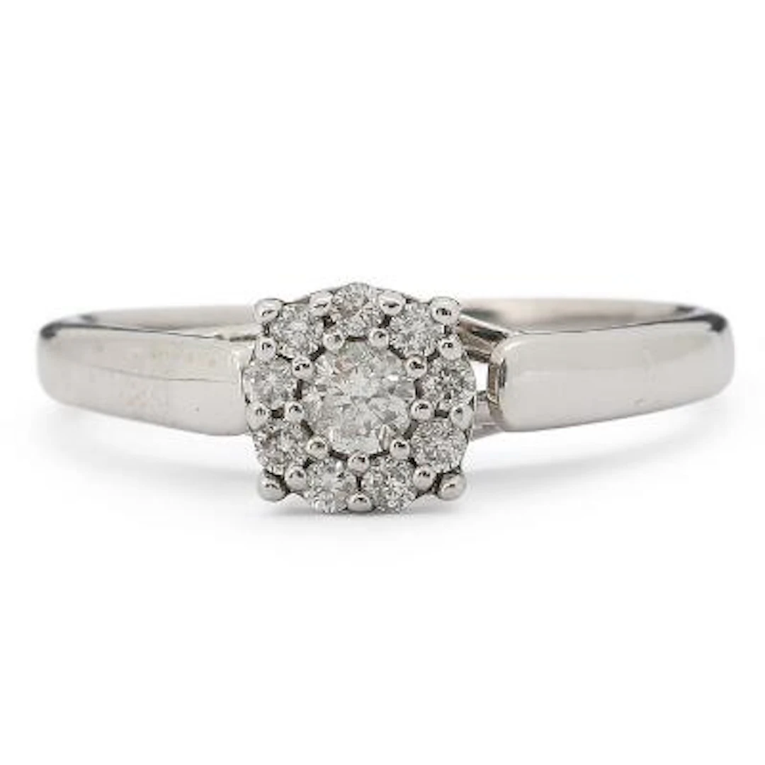 A diamond ring set with diamonds, mounted in 10k white gold. Weight