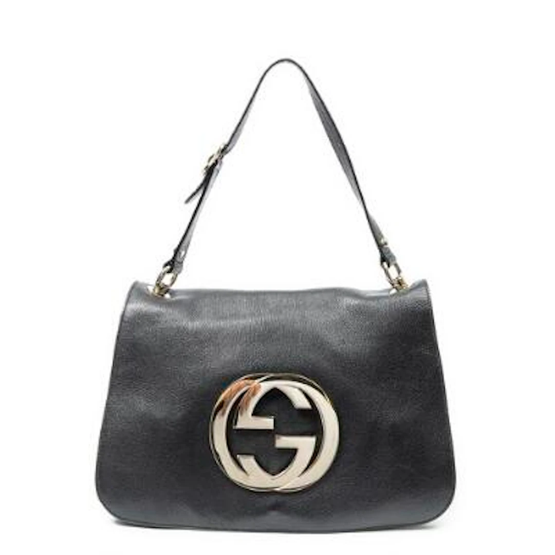 Gucci: A "Blondie" bag of black leather with gold tone hardware and
