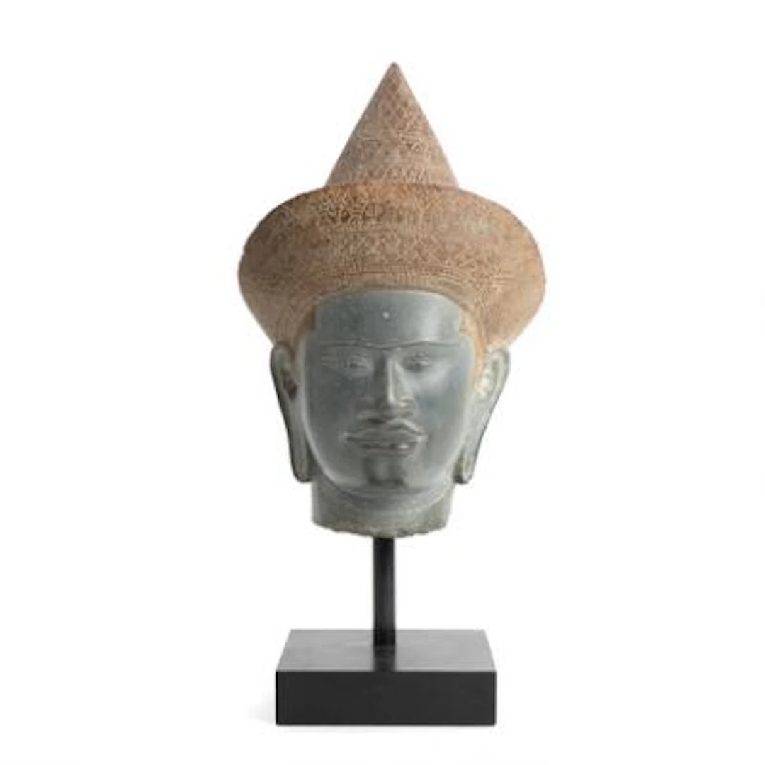 Khmer style head of partially painted stone in the form of a male