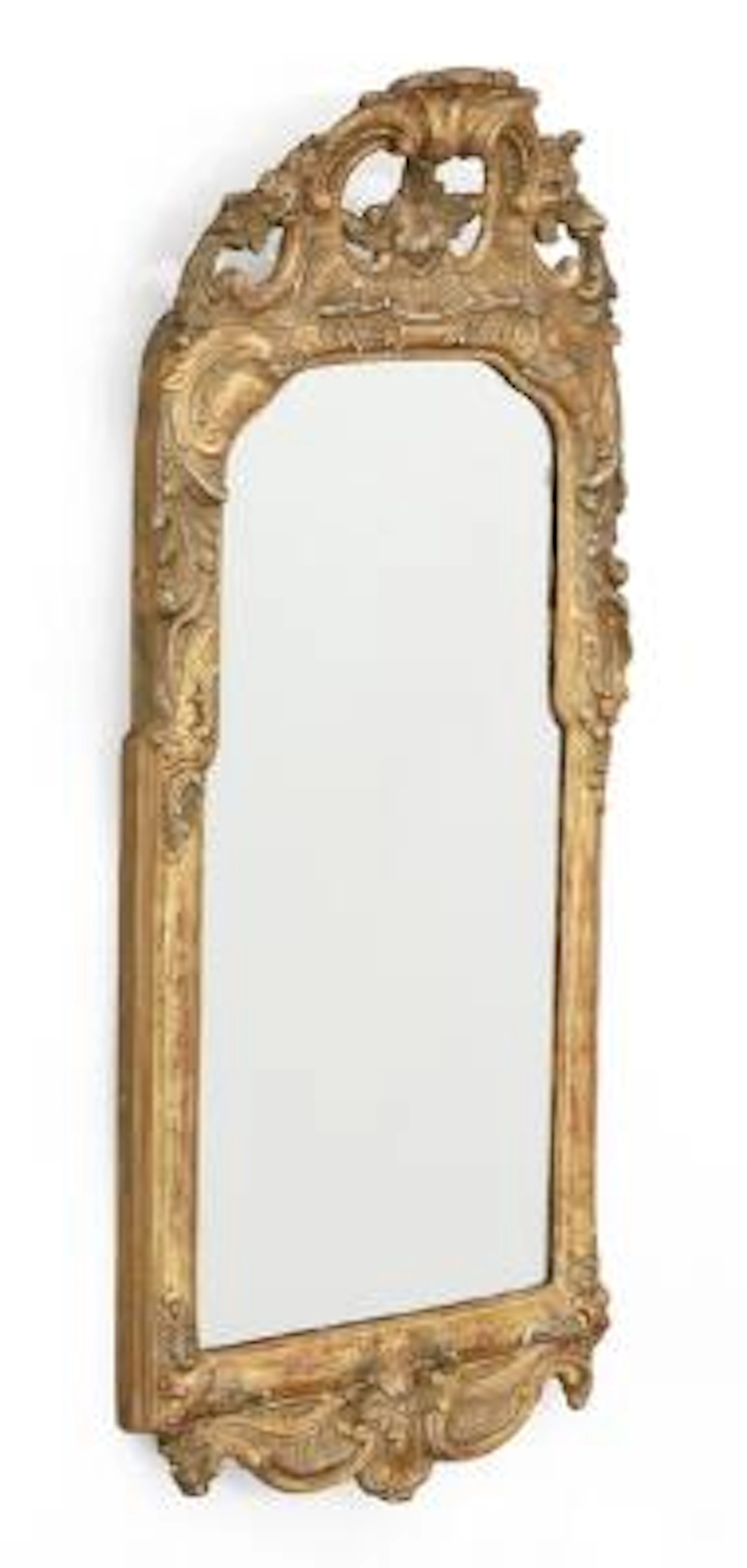A Rococo giltwood mirror, richly carved with rocaille and foliage.