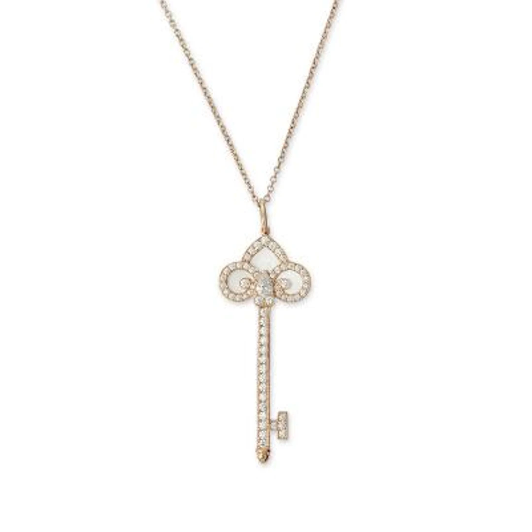 Tiffany & Co.: A "Fleur de Lis Key" pendant, mounted in 18k rose gold.