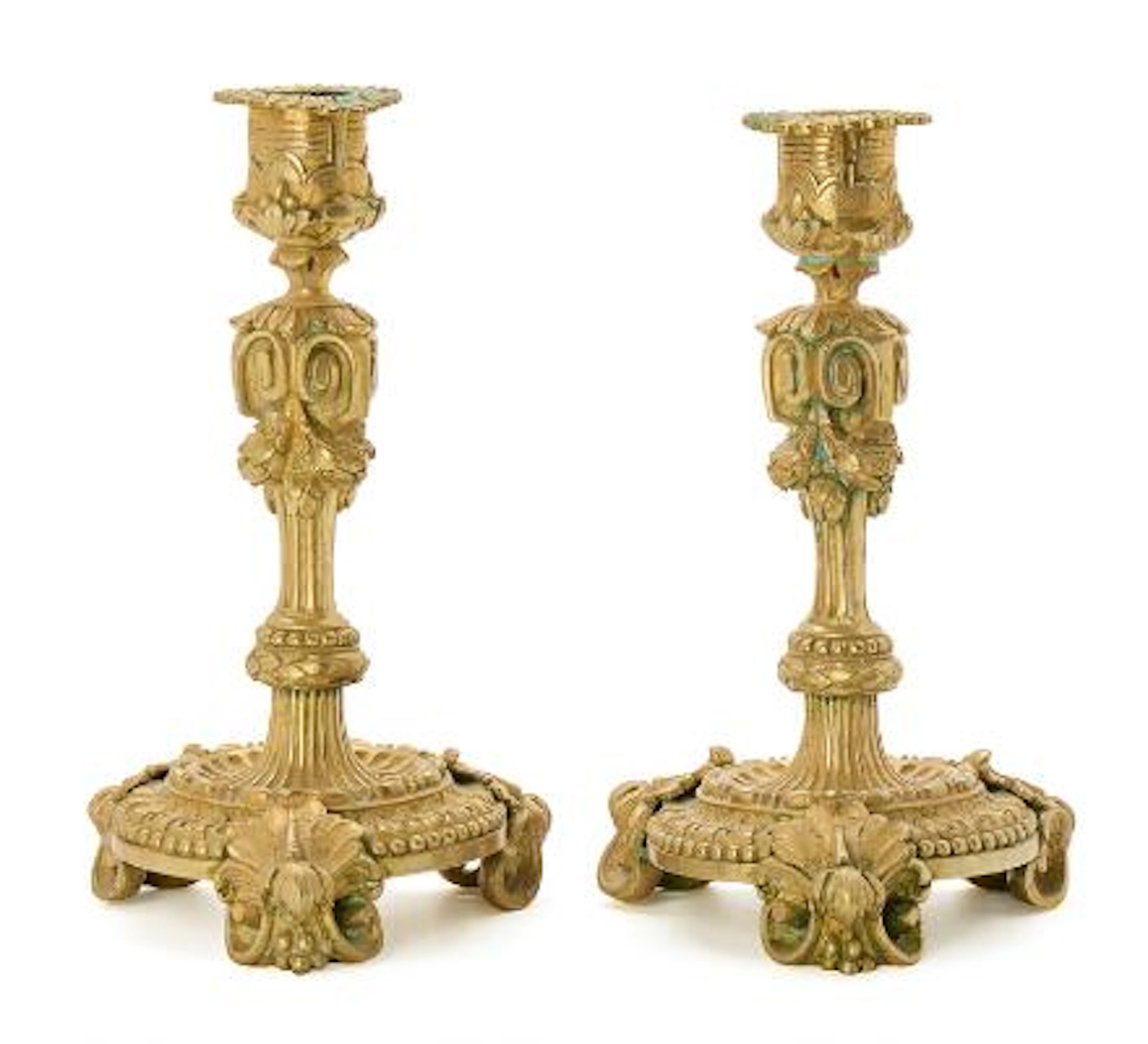 A pair of French Louis Philippe candlesticks in gilt bronze, cast