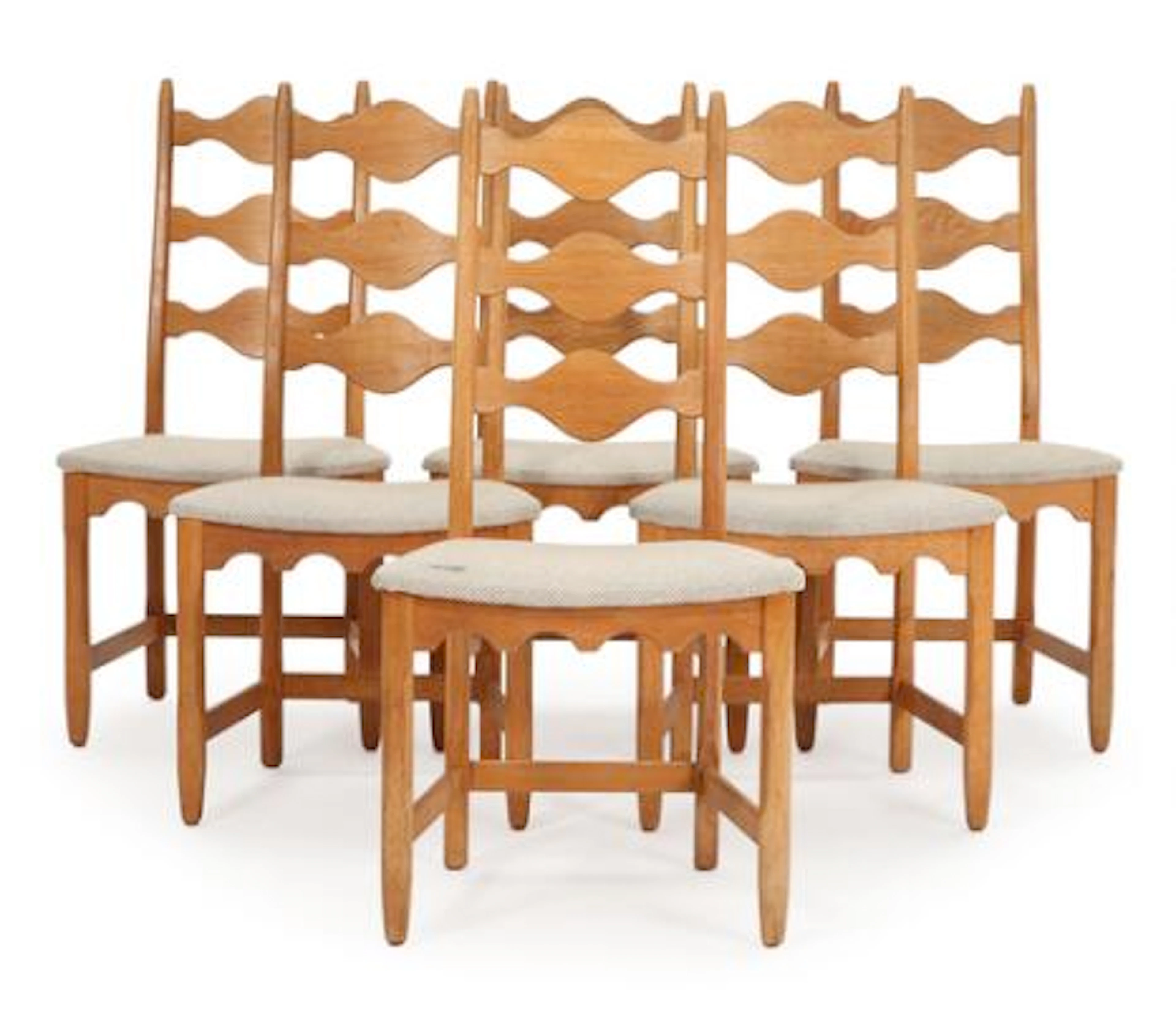 Henry Kjærnulf, ascribed to: A set of six solid oak chairs. Manufactured