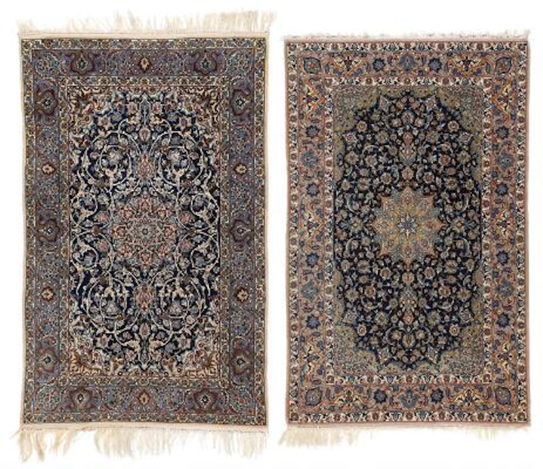 Two Persian Isfahan rugs. Medallion design on a blue field. 107 x