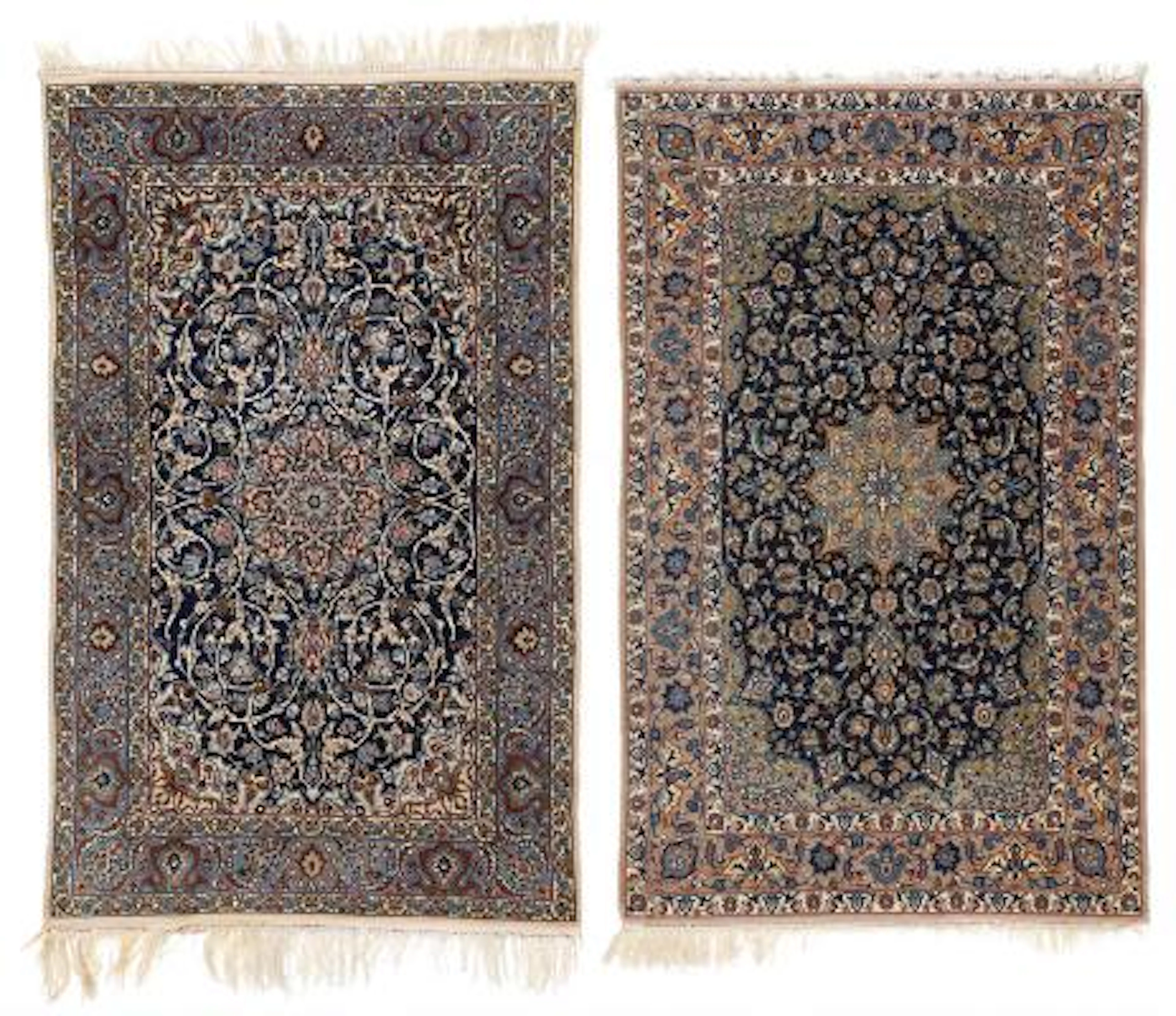 Two Persian Isfahan rugs. Medallion design on a blue field. 107 x