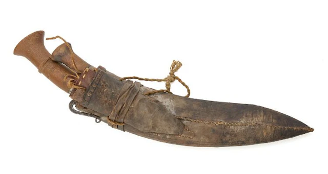 A Nepalese kukri in a scabbard. – Bruun Rasmussen Auctioneers