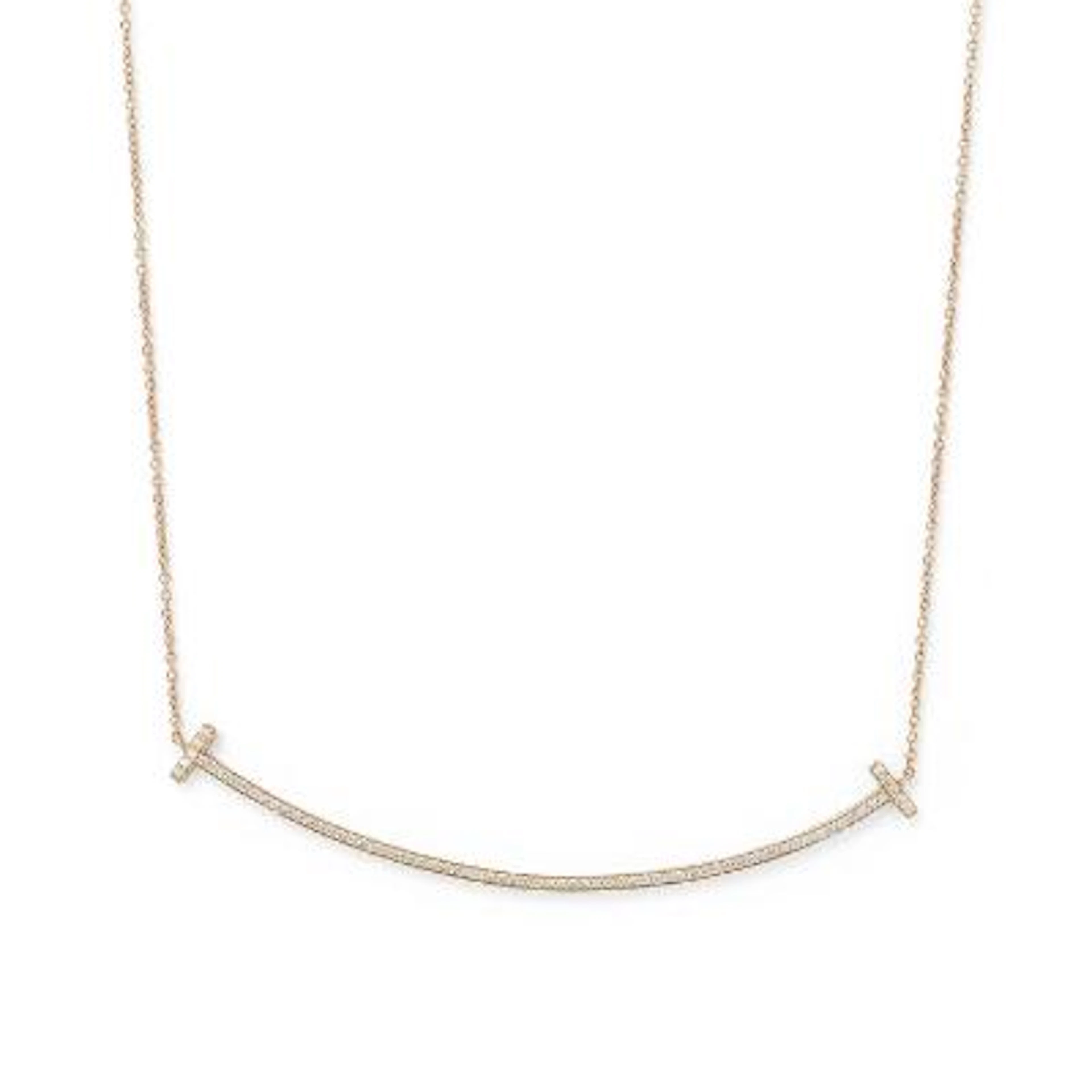 Tiffany & Co.: A "Large T Smile" necklace set with a diamond pendant