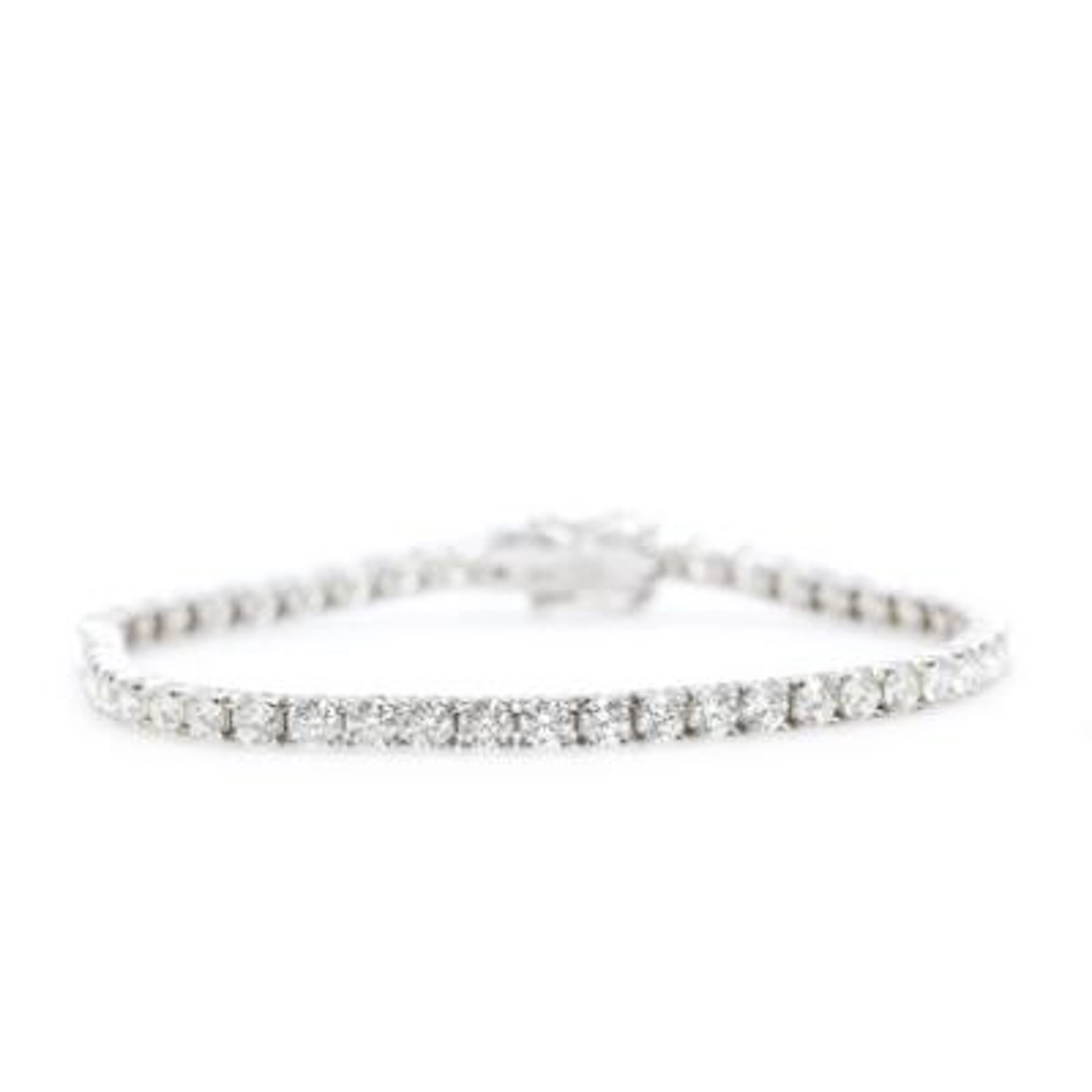 A diamond tennis bracelet set with 50 brilliant-cut diamonds weighing