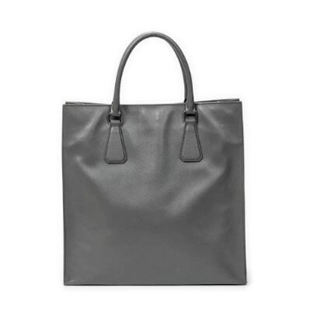 Prada: A tote bag of grey Saffiano-leather with two handles and silver-tone
