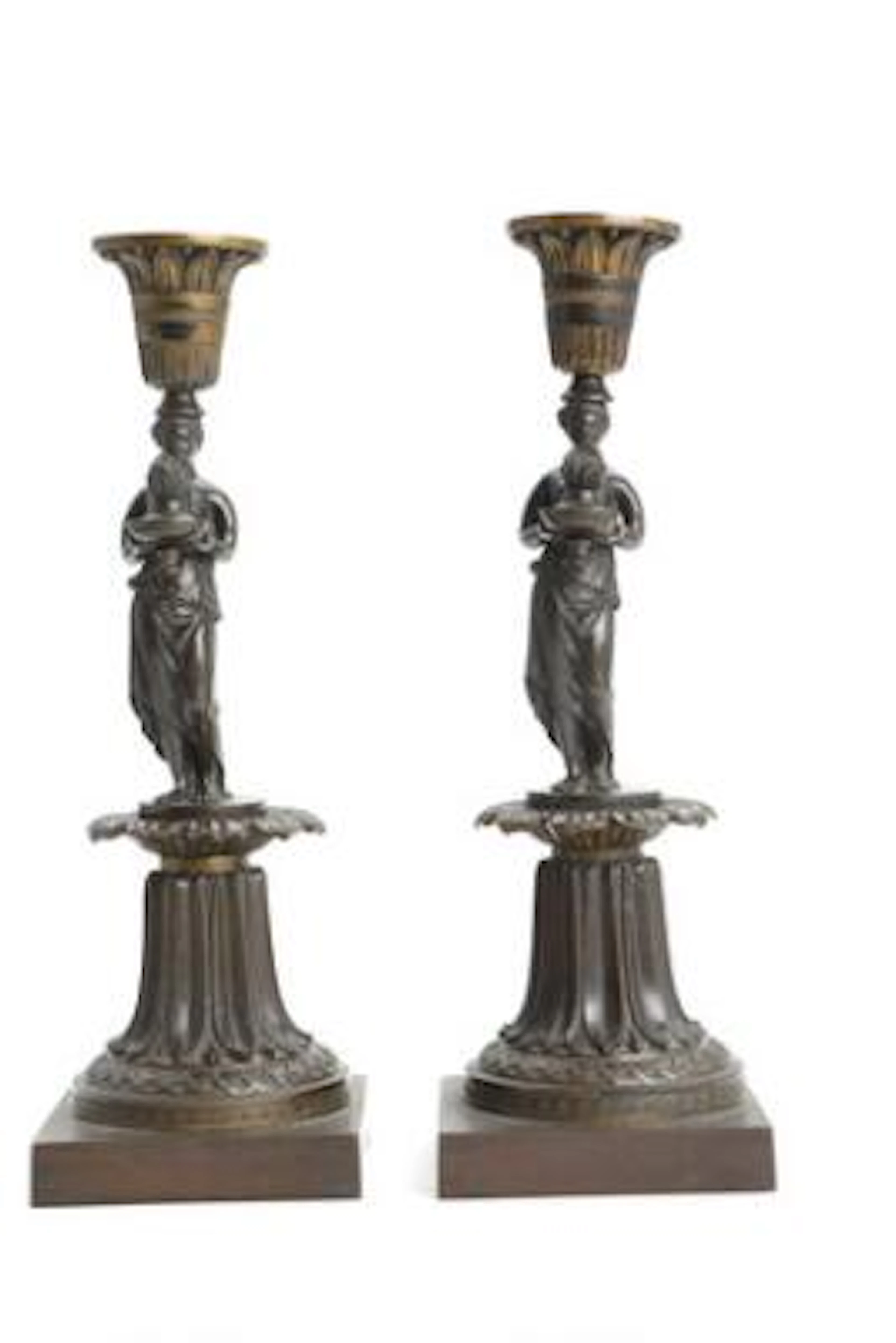 A pair of English candlesticks in patinated bronze. Messenger and