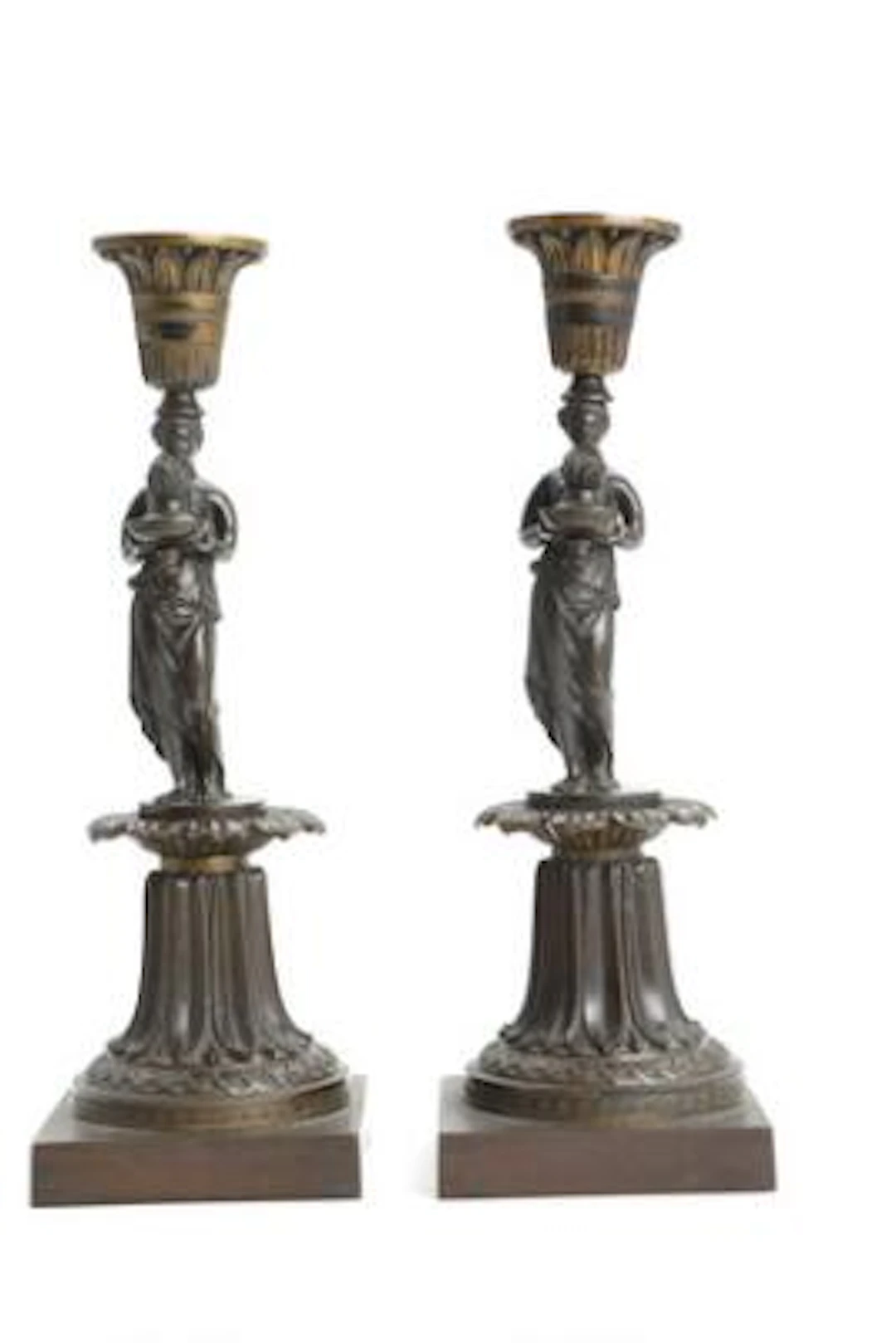 A pair of English candlesticks in patinated bronze. Messenger and