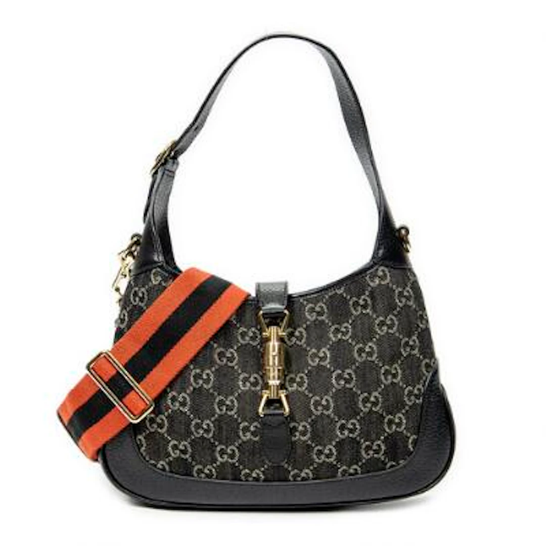 Gucci: A "New Small Jackie 1961" bag in black/beige monogram canvas