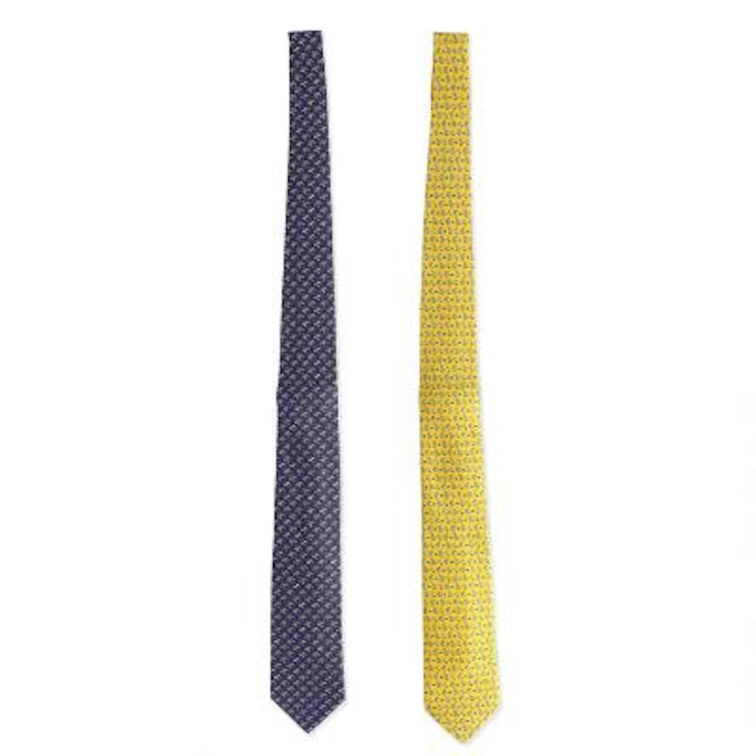 Hermès: A set comprising of two silk ties, each set with a motif.