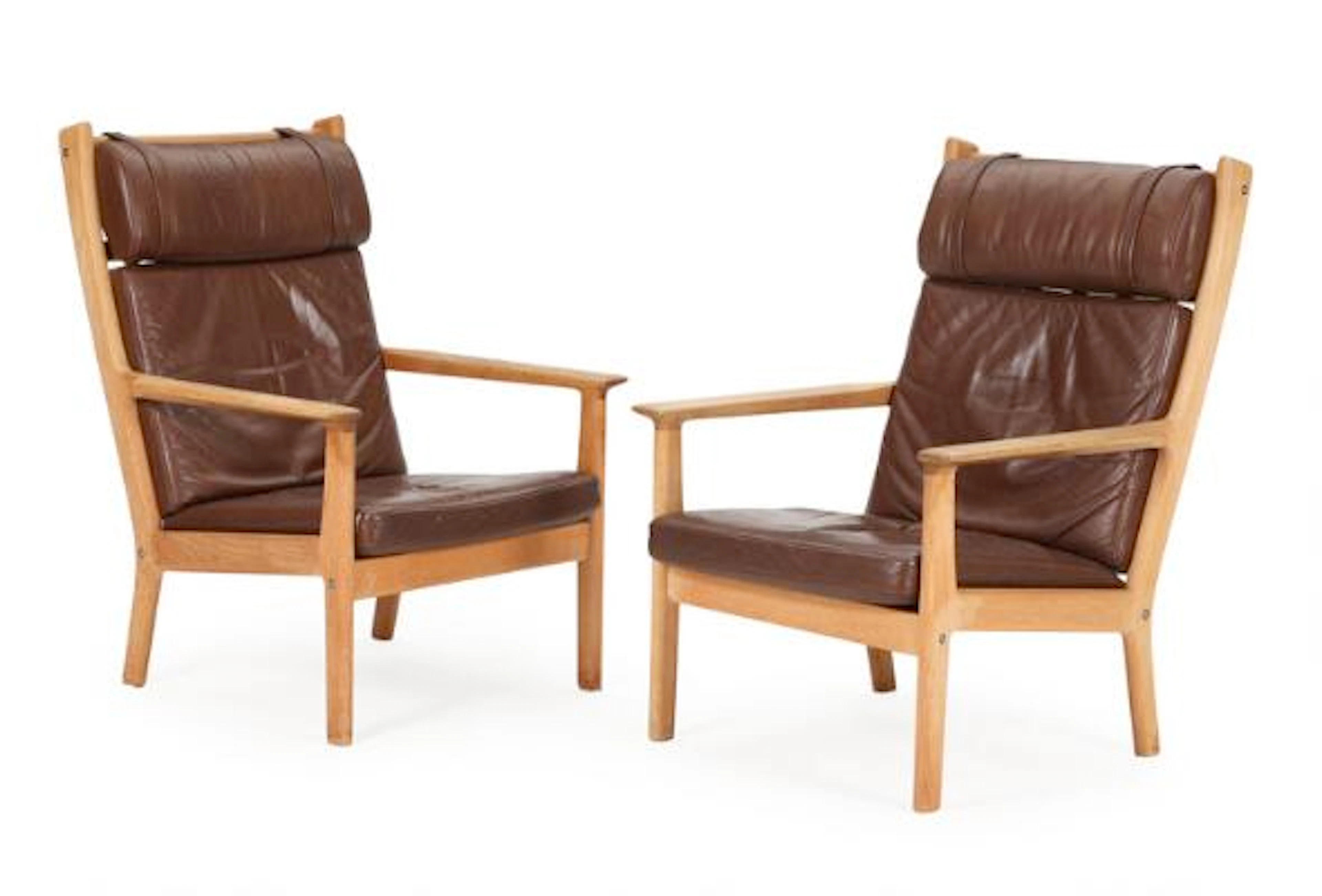 Hans J. Wegner: High-backed oak easy chair and stool, upholstered