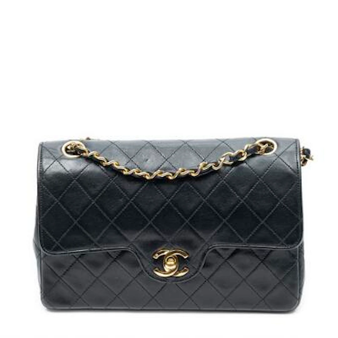 Chanel: A "Small Curved Double Flap" bag in black quilted leather