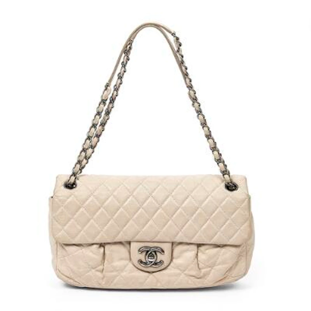 Chanel: A "Single Flap" bag in cream-coloured quilted leather with