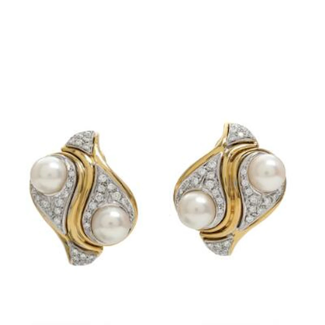 A pair of pearl and diamond ear clips each set with pearls and diamonds