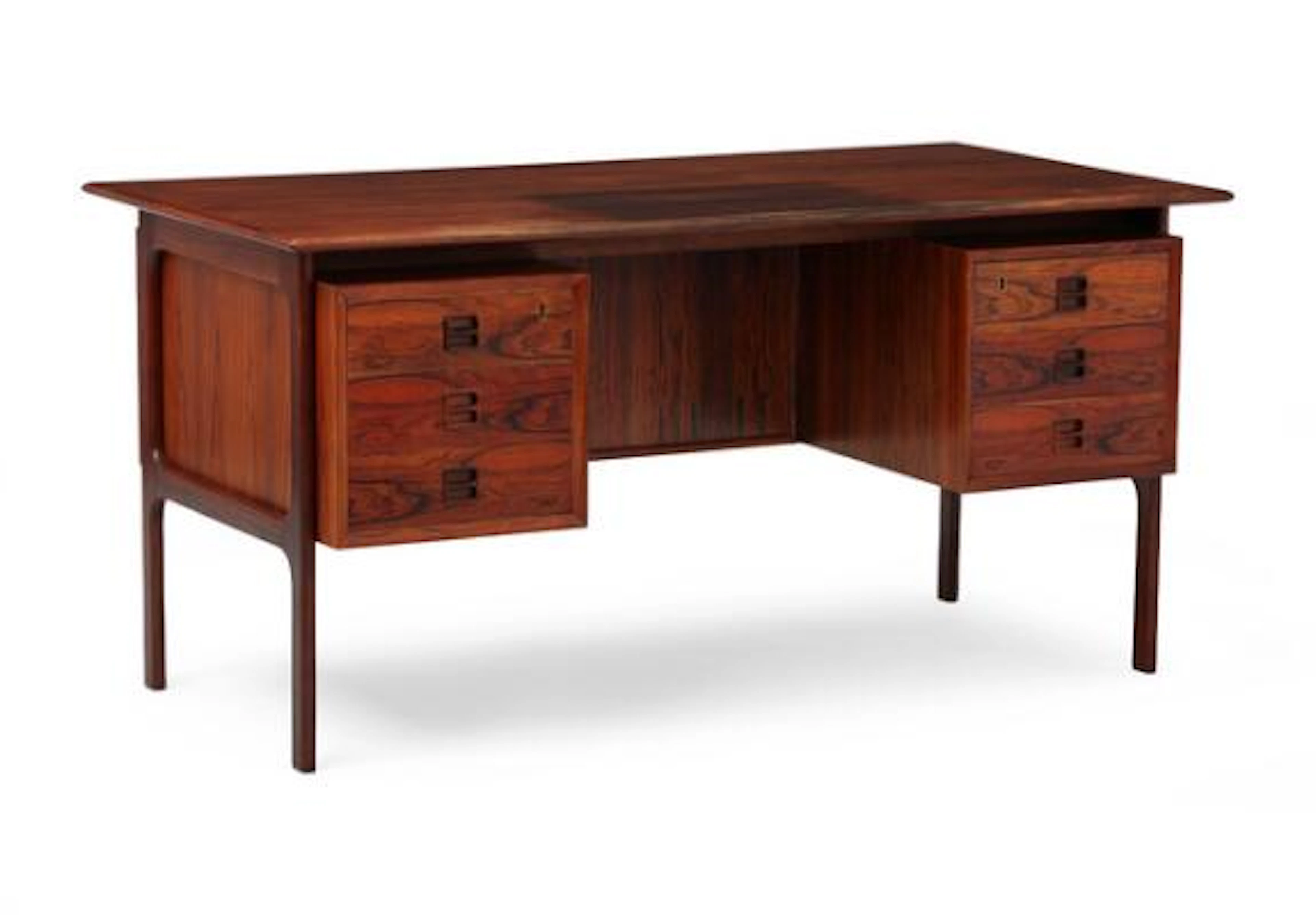 Edmund Brouer: Freestanding rosewood desk with floating top. Manufactured