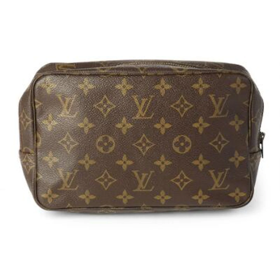 Louis Vuitton: A toiletry bag of brown and beige monogram canvas with
