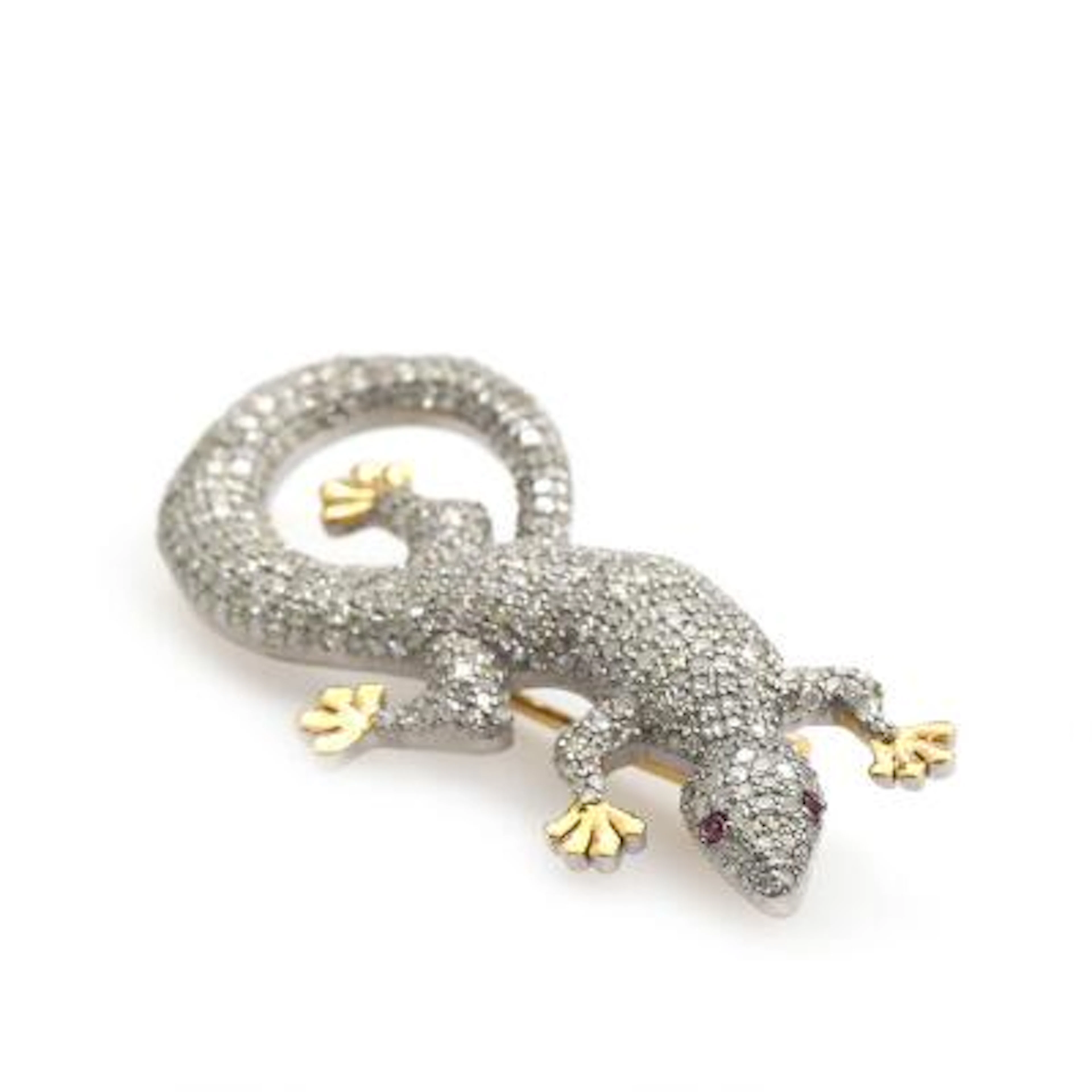 A lizard diamond and ruby brooch, decorated with single-cut diamonds