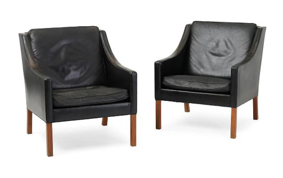 Børge Mogensen: A pair of armchairs with walnut legs. Upholstered