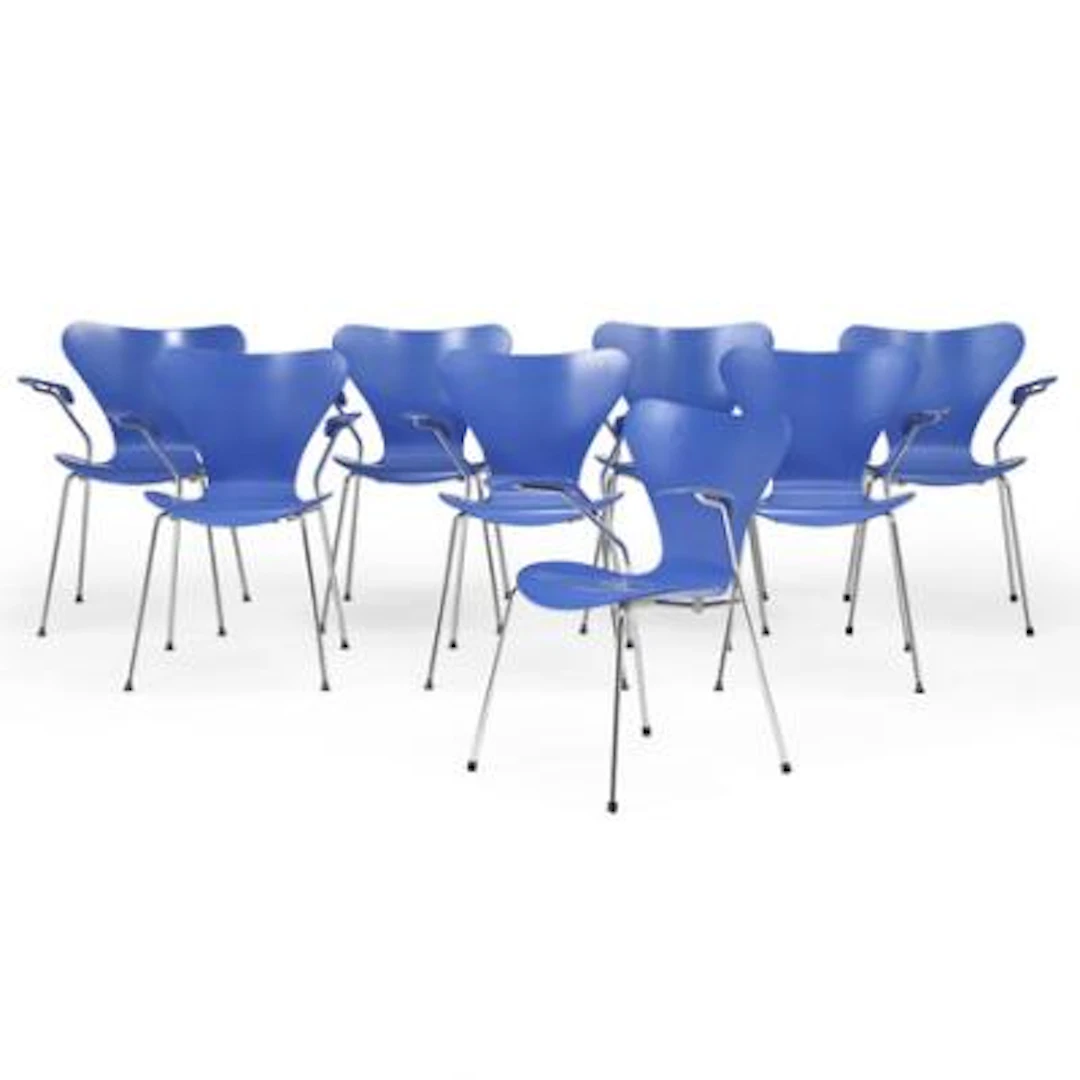 Arne Jacobsen: "The Seven". Set of eight armchairs with steel legs.