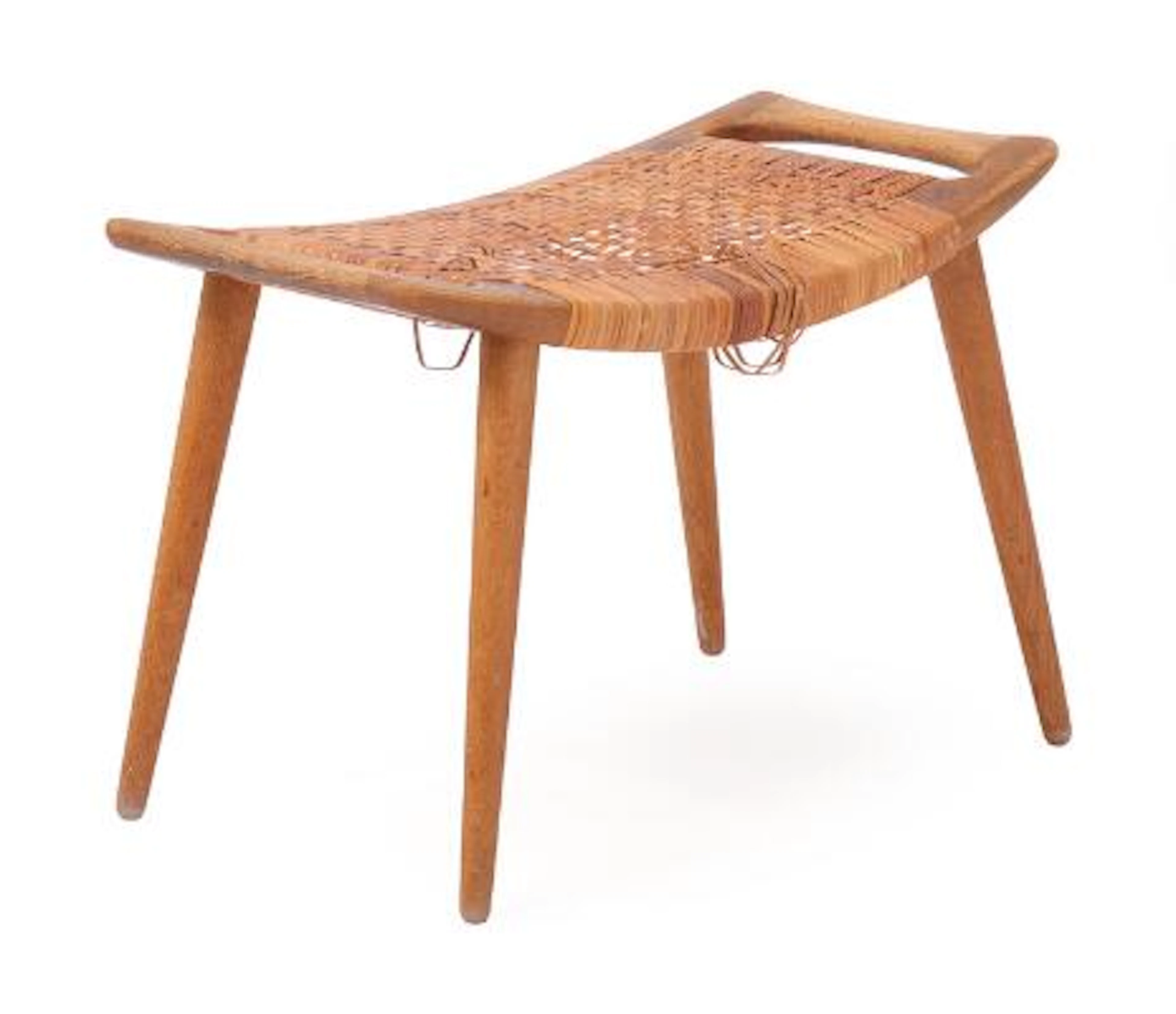 Hans J. Wegner: “JH 539”. A solid oak wood stool. Seat with woven