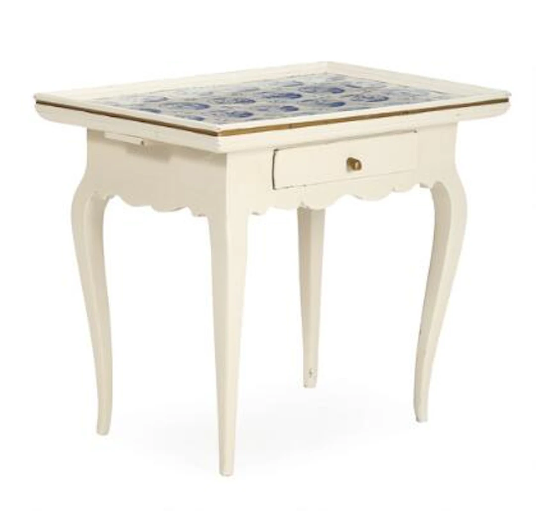 A Danish country style Rococo tile table of white painted wood. Plate