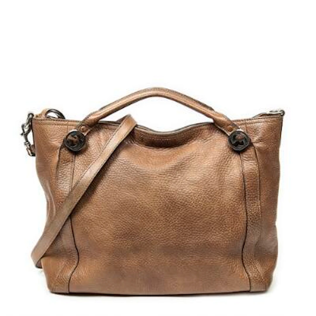 Gucci: A "Miss GG Convertible Tote" in brown leather with silver-toned