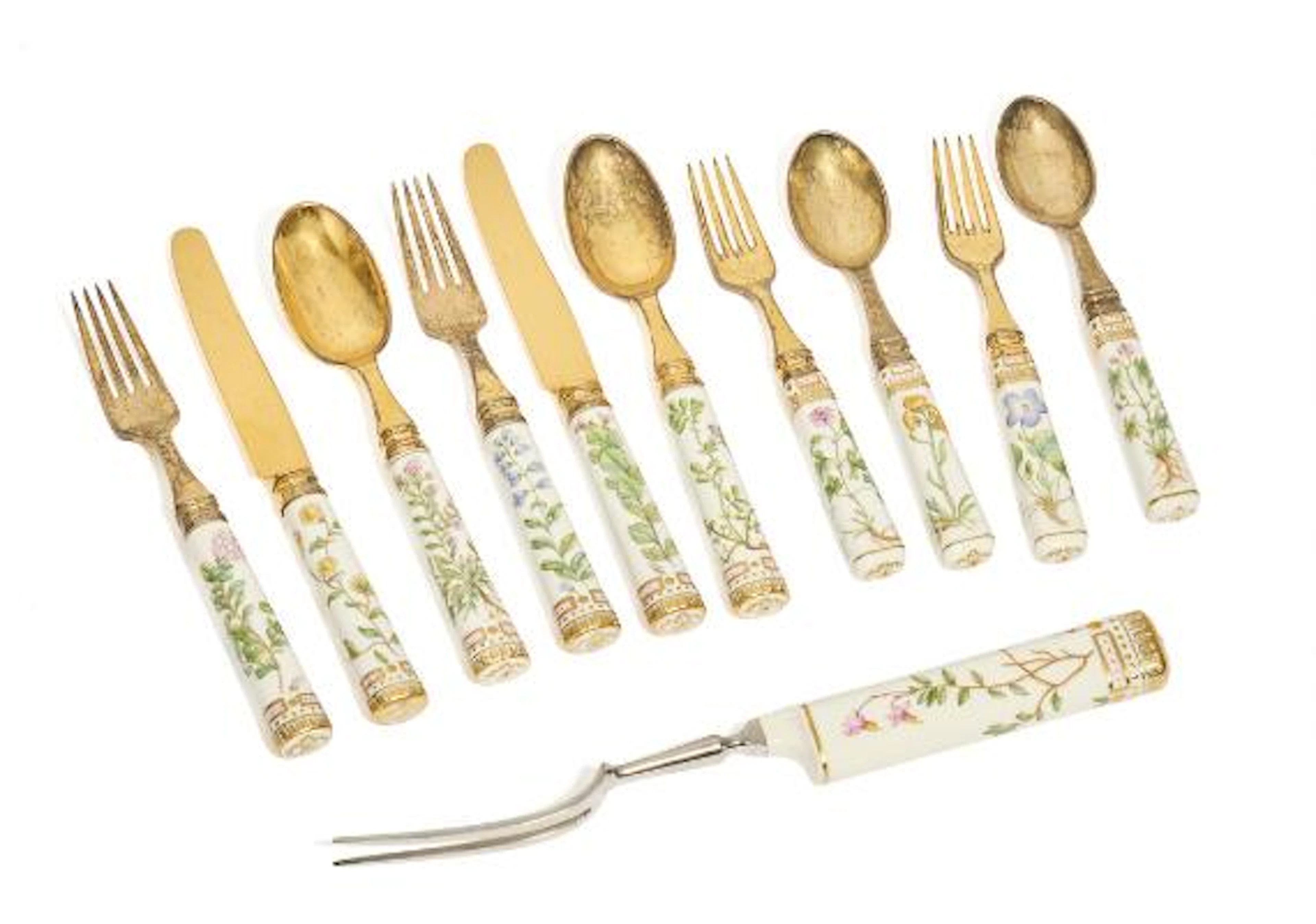 “Flora Danica” gilt sterling silver and porcelain cutlery. (11) –