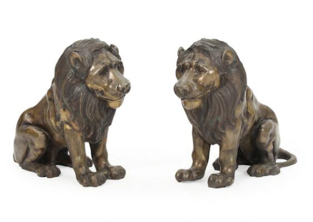 A pair of seated lions in bronze. 20th century. H. 54. L. 56 cm. (2)