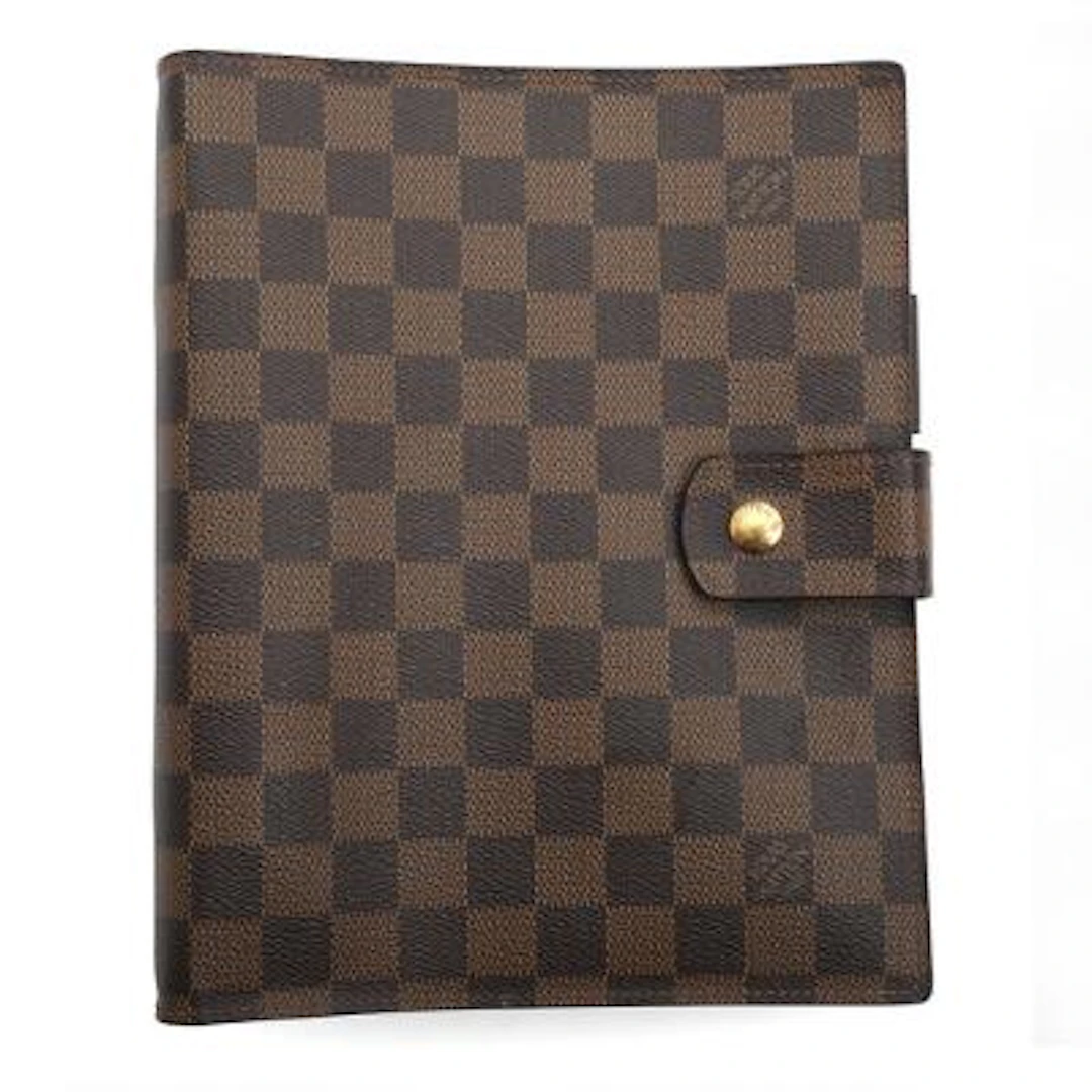Louis Vuitton: A calendar cover of Damier Ebene with gold tone hardware