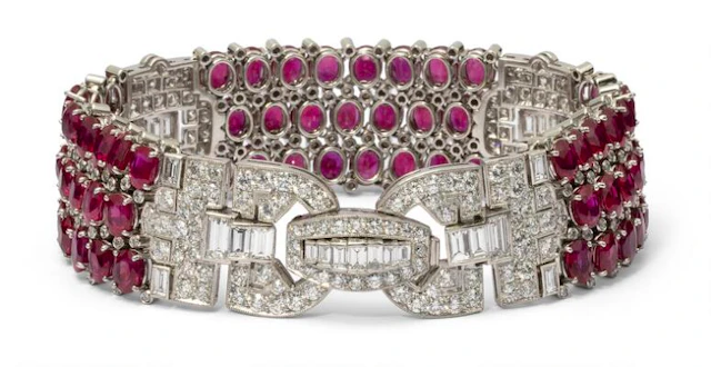 A ruby and diamond bracelet set with numerous rubies and diamonds