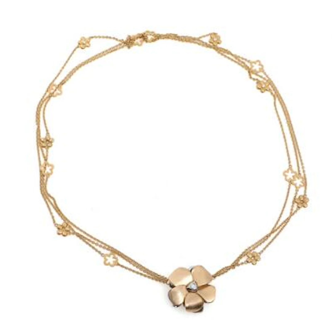 Ole Lynggaard: Flower clasp in 14k gold and white gold set with diamonds