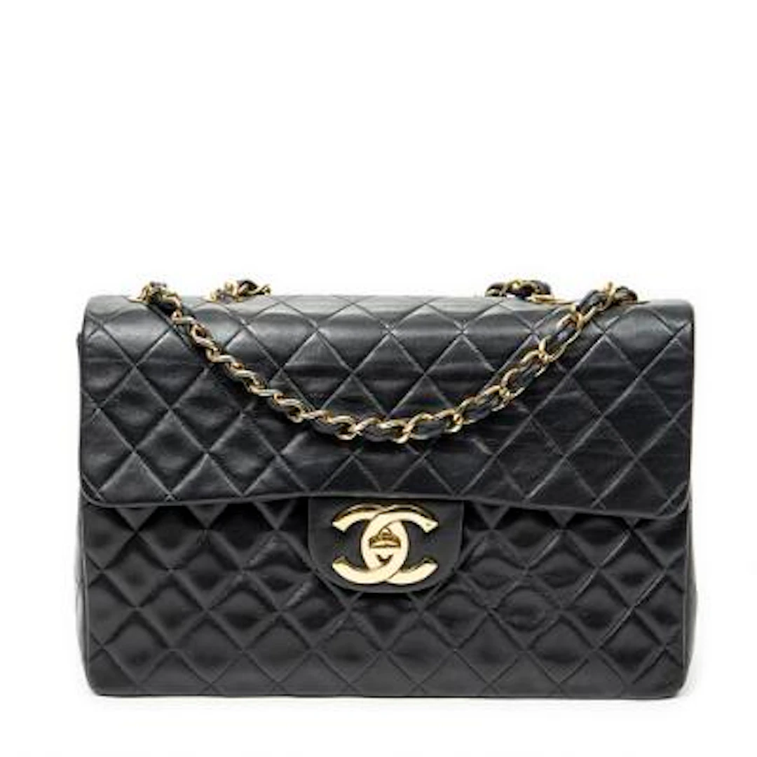 Chanel: A "Maxi Jumbo XL Flap" bag of black quilted leather with gold-tone