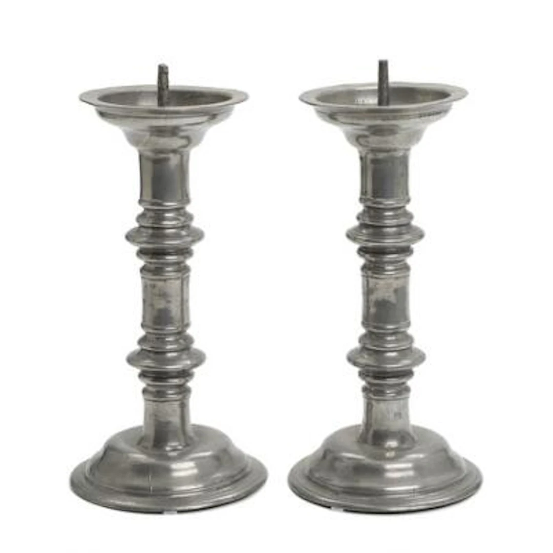 A pair of Baroque church candlesticks in tin, engraved with inscription