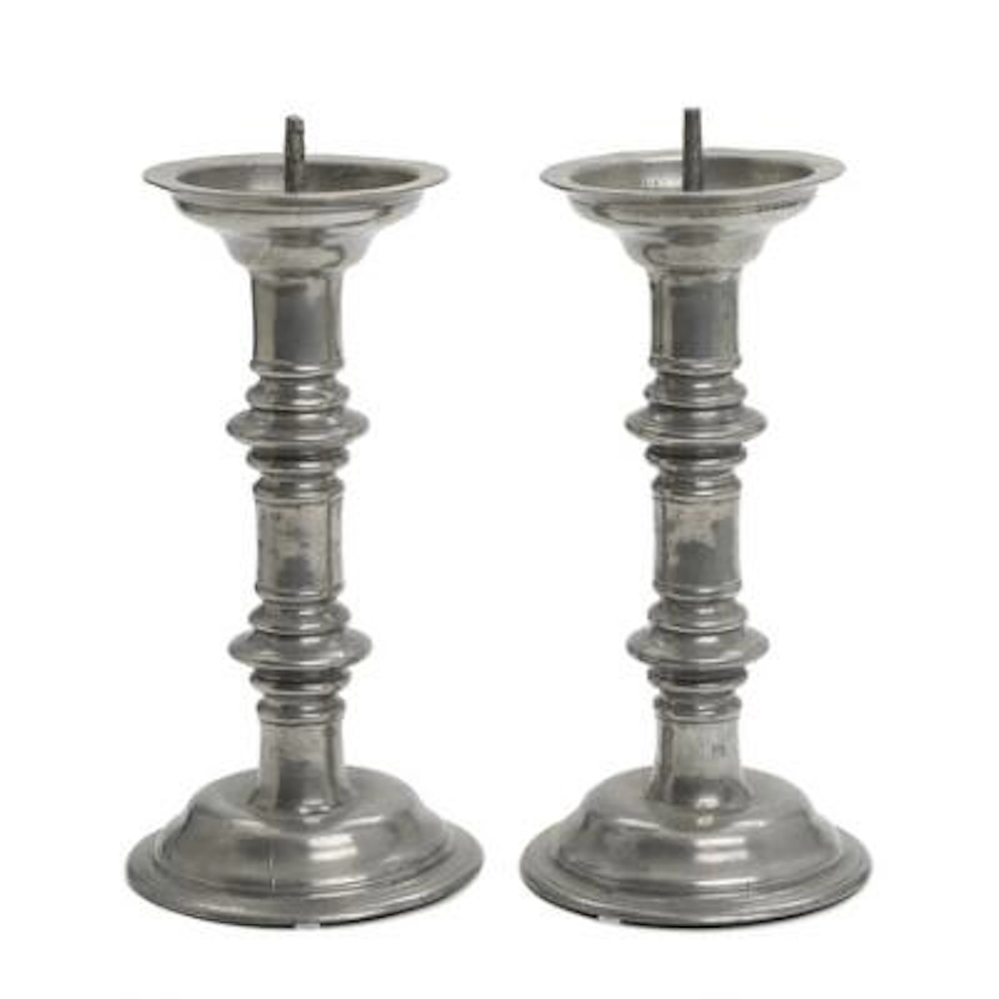 A pair of Baroque church candlesticks in tin, engraved with inscription