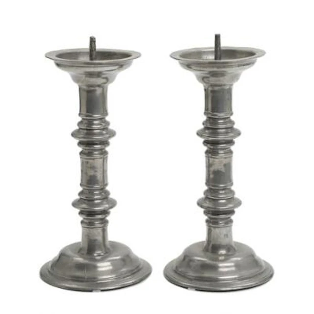 A pair of Baroque church candlesticks in tin, engraved with inscription