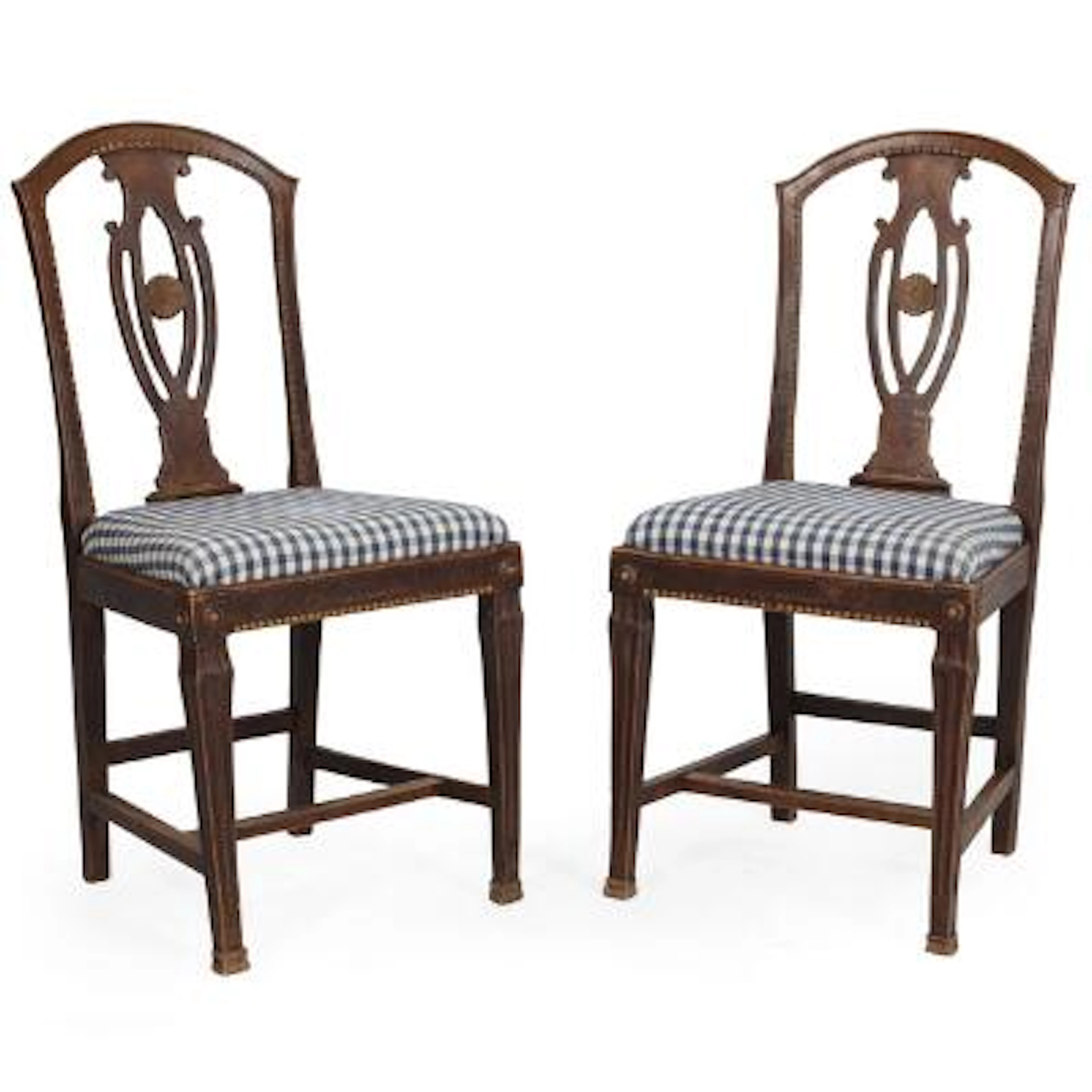 A pair of stained wood chairs, pierced, vase-shaped backrest. Louis