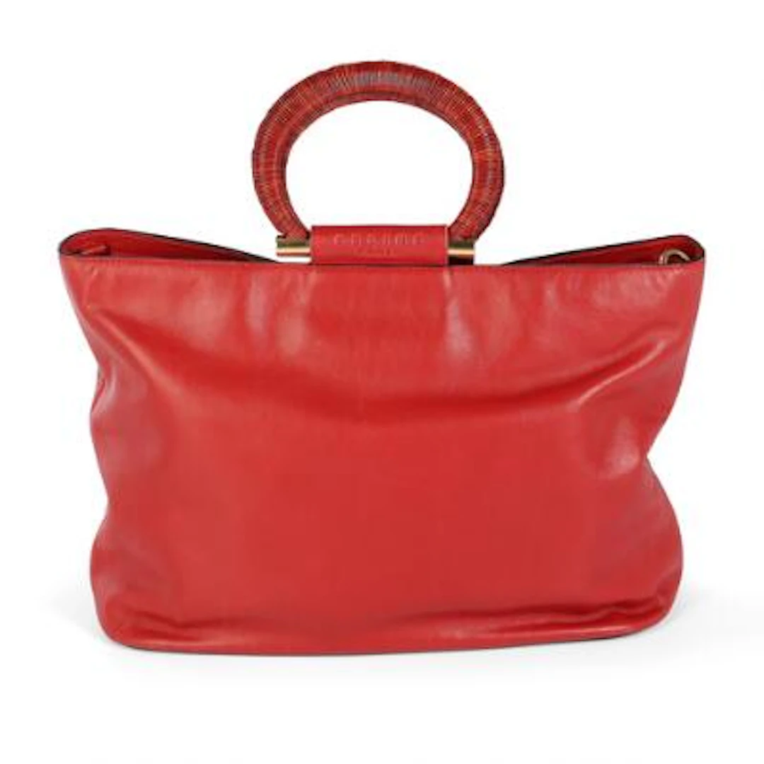 Celine: A red bag of leather with gold tone hardware, short handle