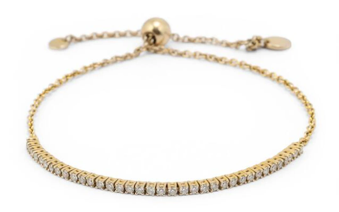 A diamond bracelet set with numerous diamonds mounted in 18k gold.
