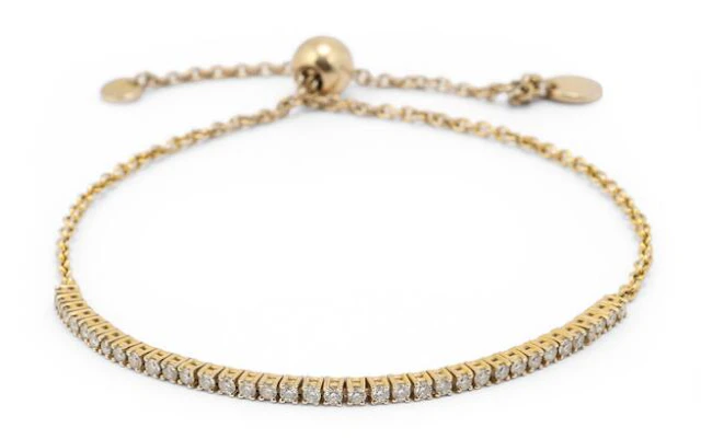 A diamond bracelet set with numerous diamonds mounted in 18k gold.