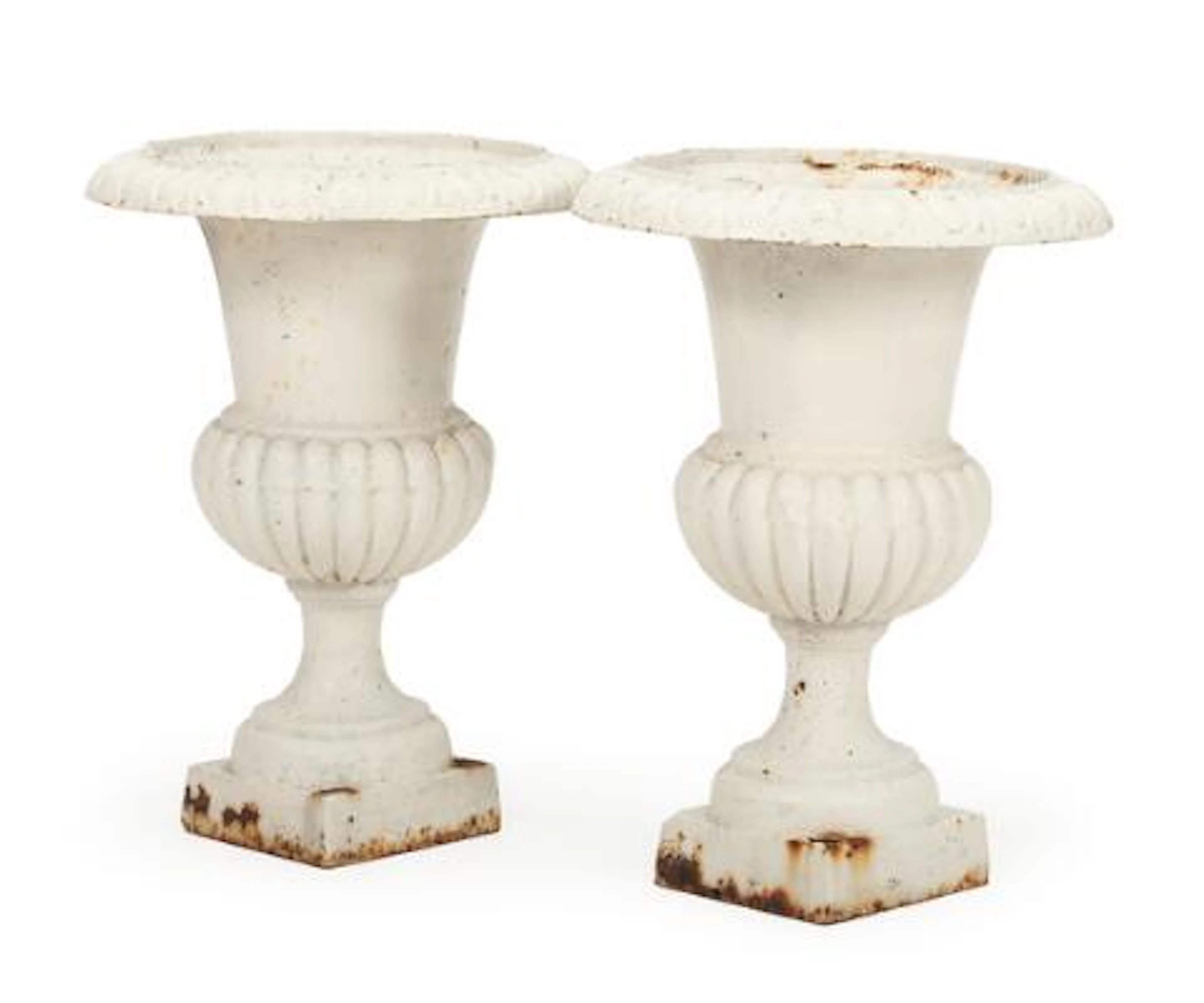 A pair of white-painted cast iron garden vases, decorated with ornamental