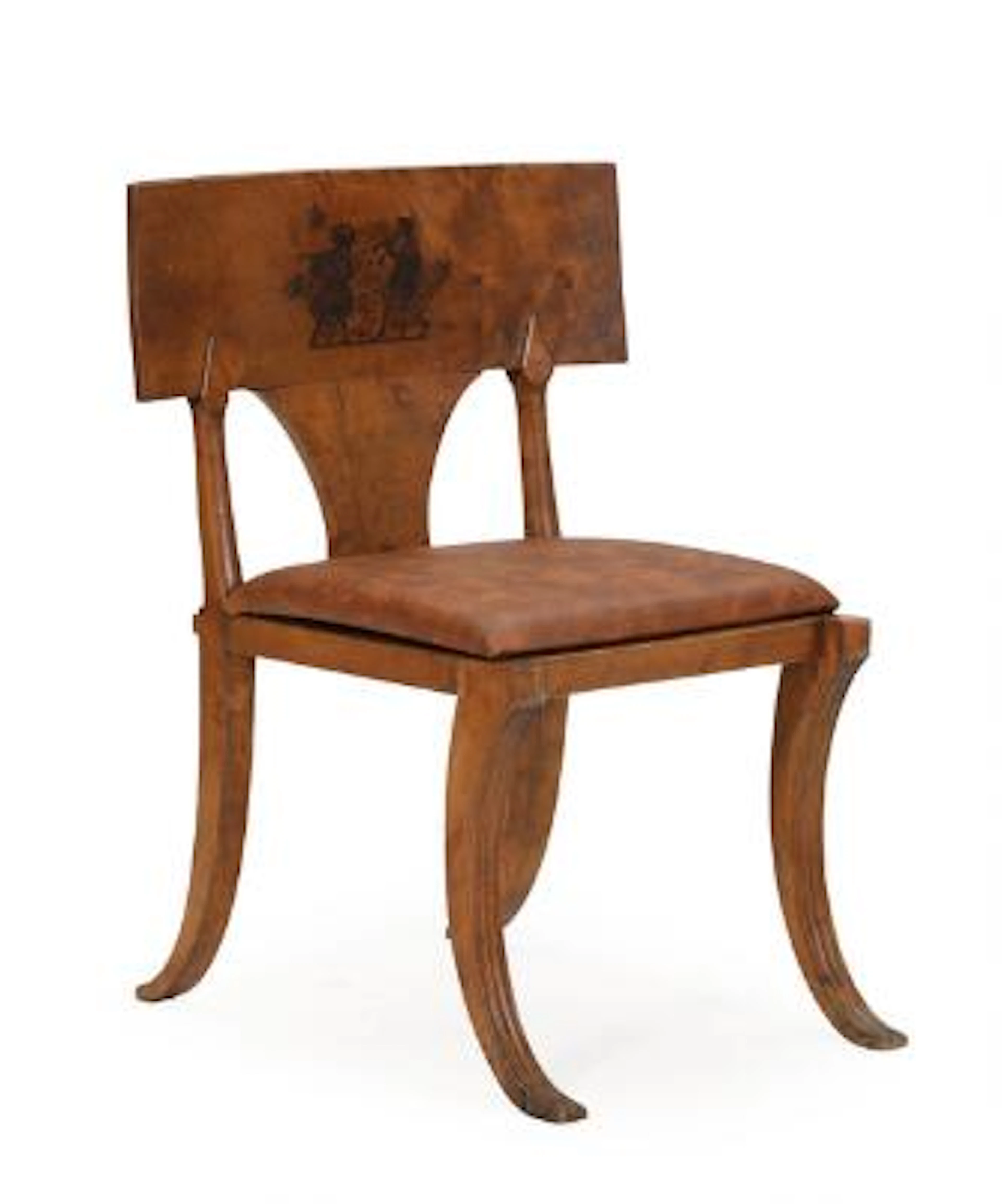 A circa 1800 birch klismos chair with slightly curved backrests decorated
