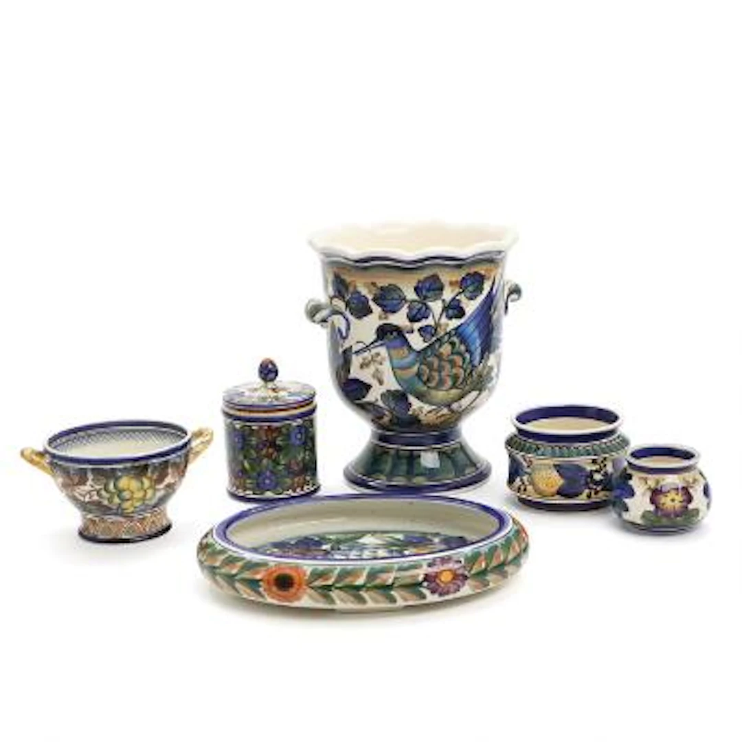 A selection of faience, decorated in colours with bird, fruit and