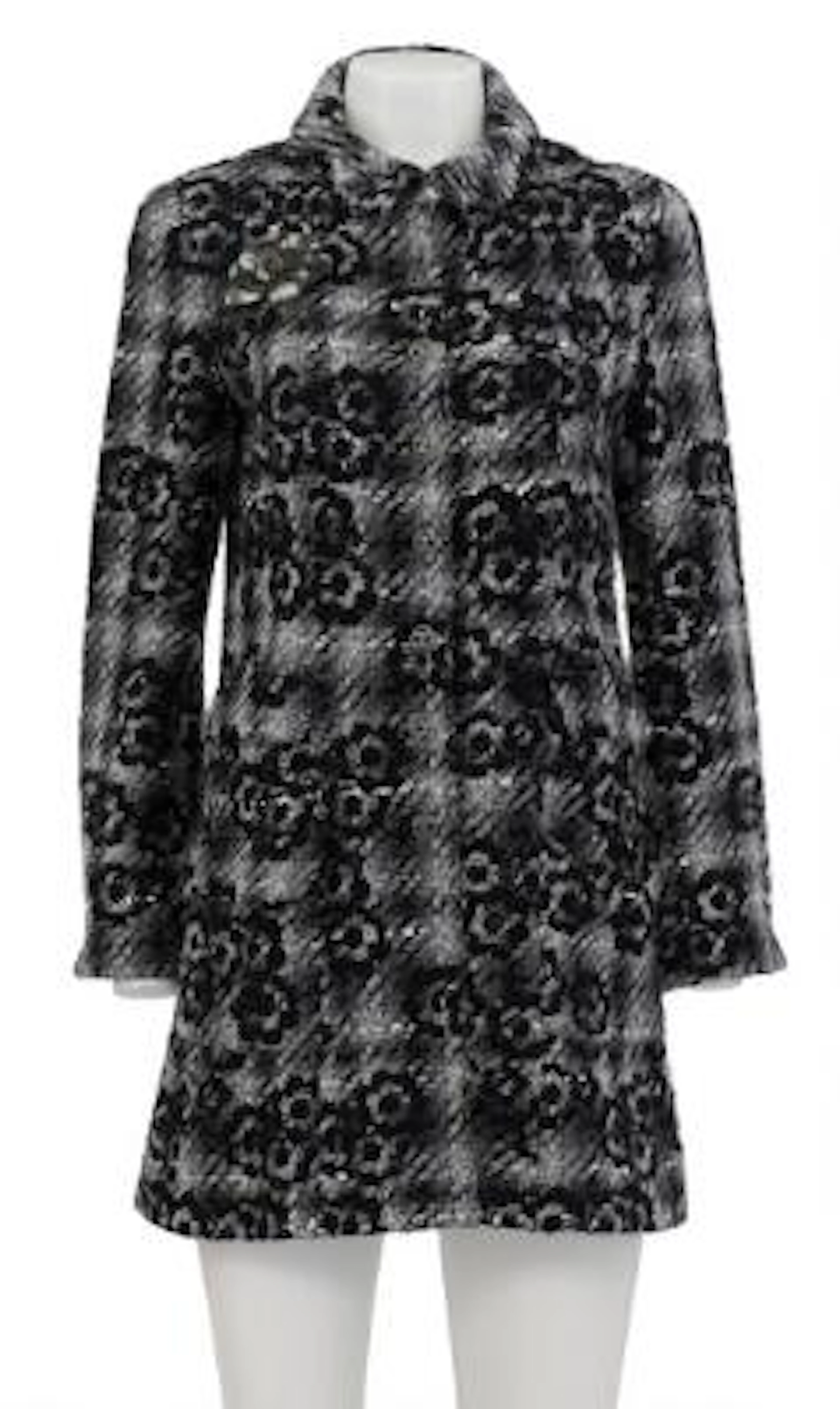 Chanel: A grey/black tweed jacket of a wool blend with a collar and